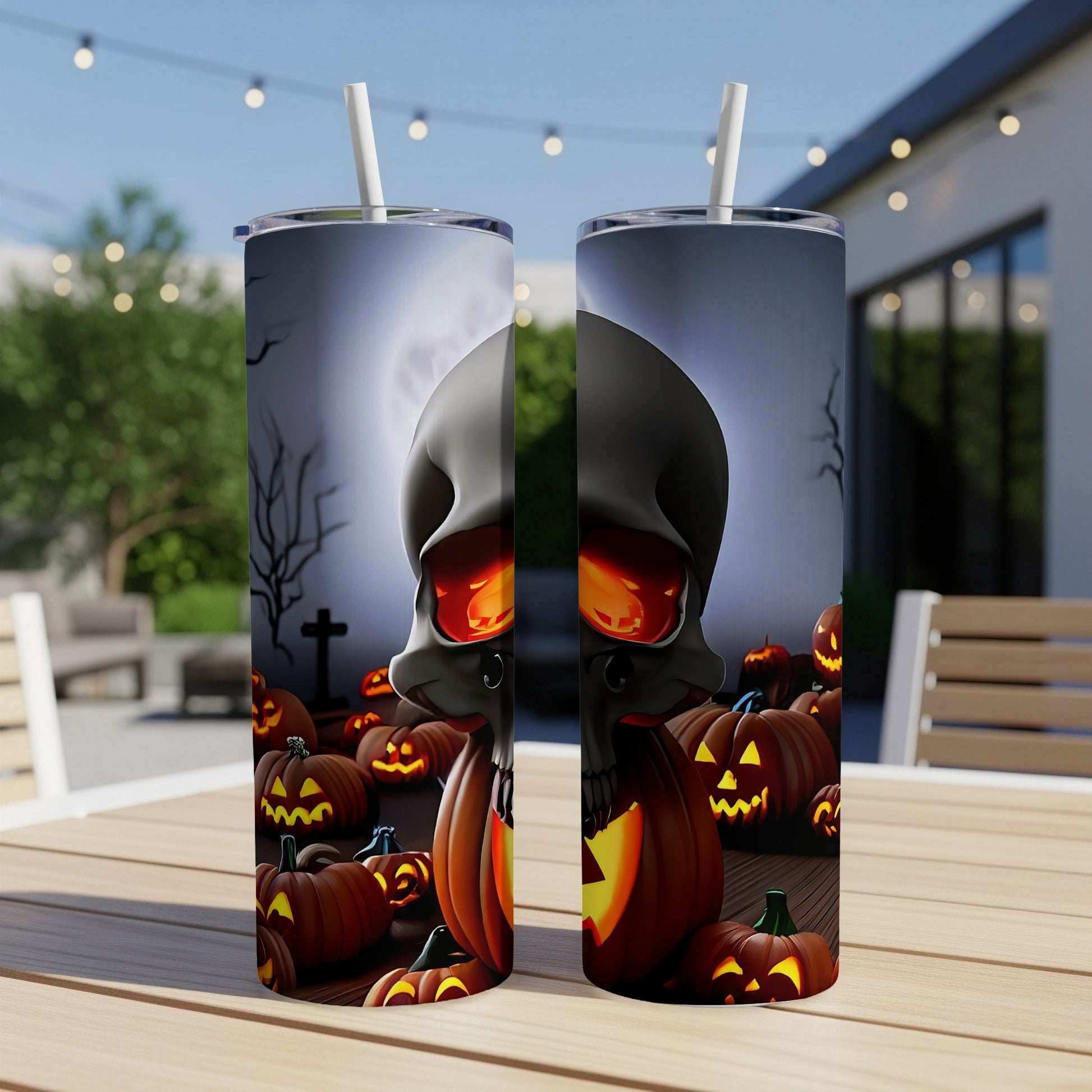 Two tumblers featuring a Halloween design with a skull and carved pumpkins.