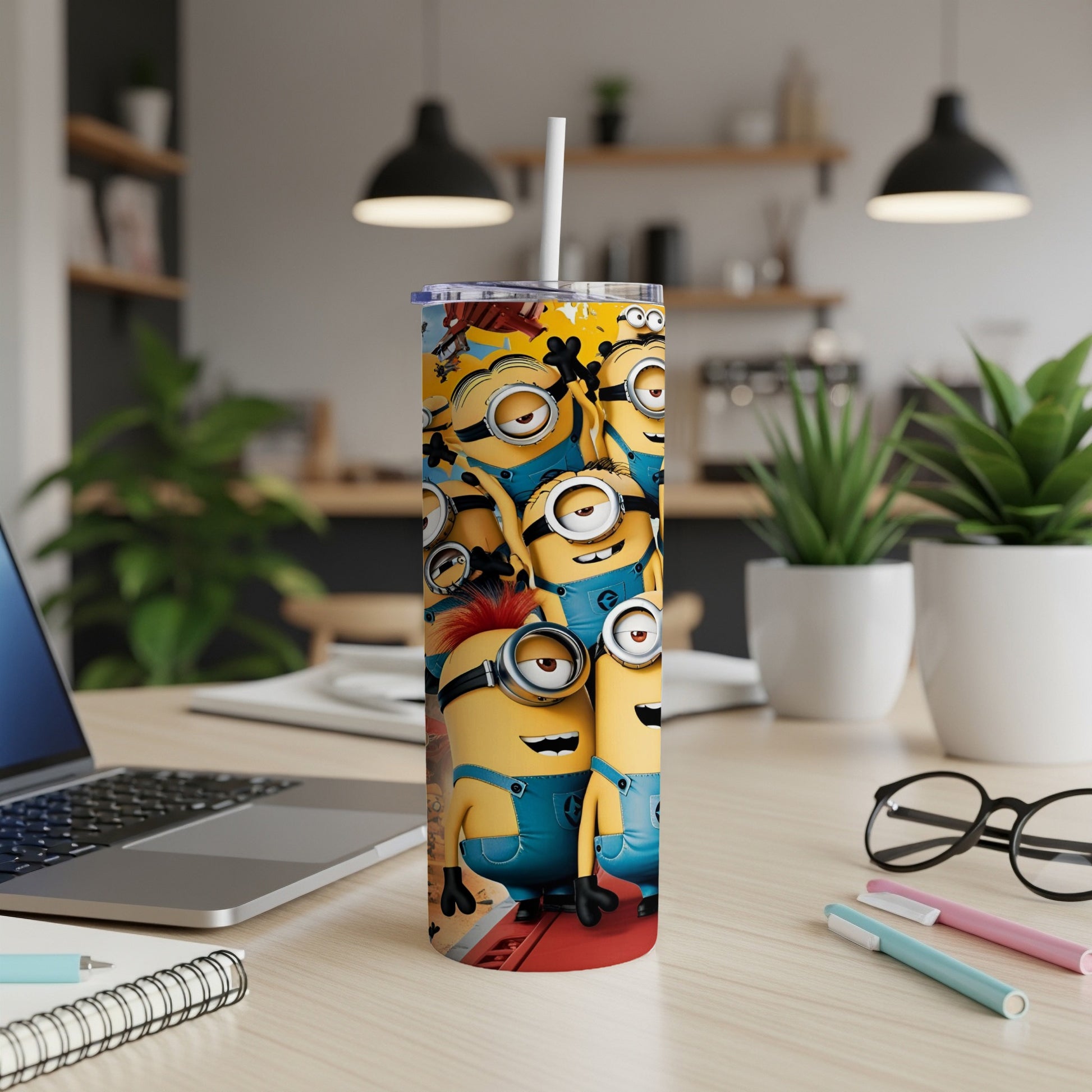 Yellow Minions with goggles on a tall, slim tumbler cup.