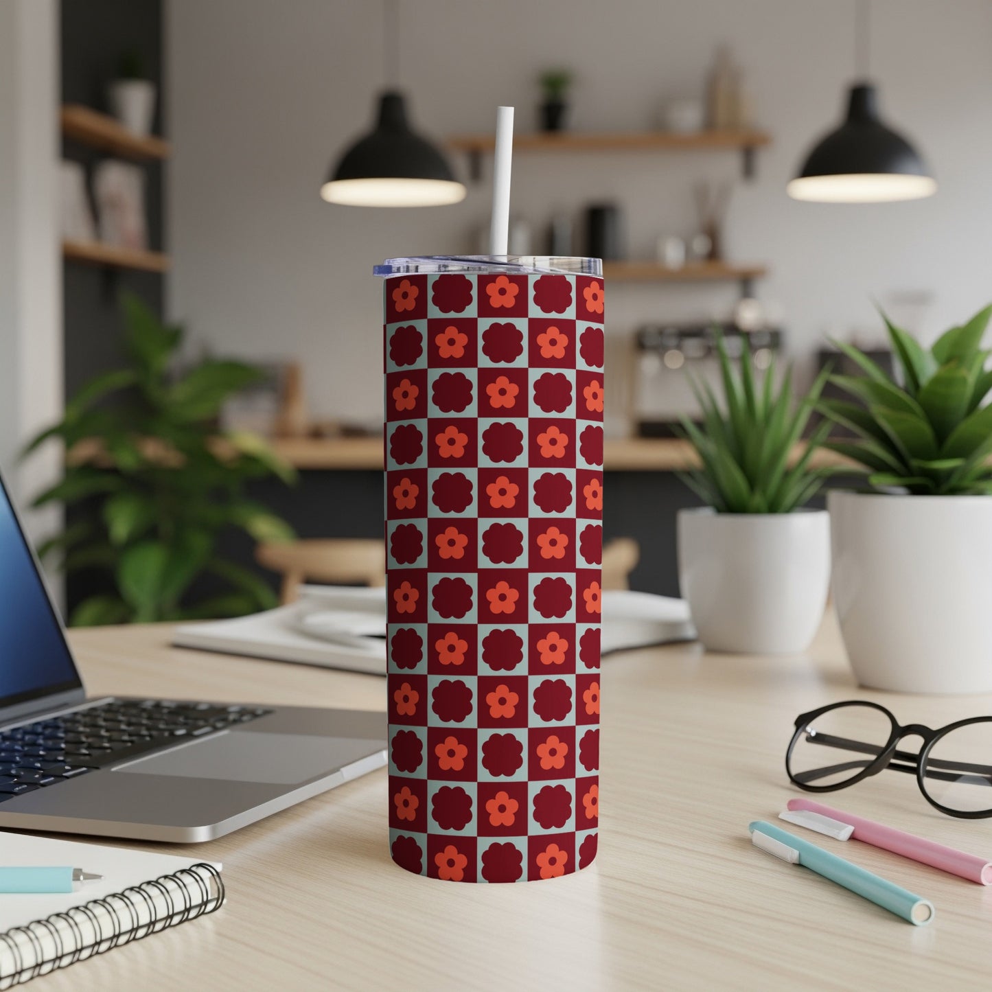 Tall tumbler with a red and blue floral checkered pattern.