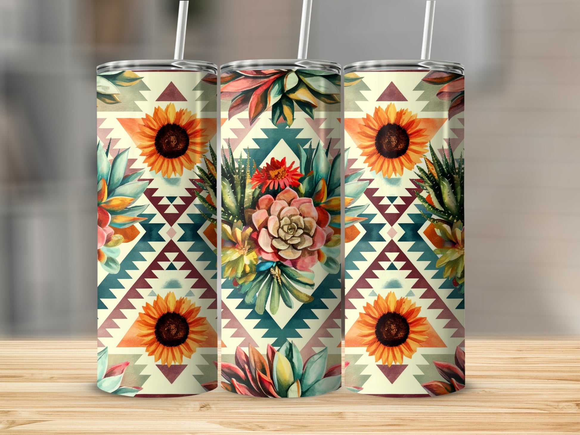 Three tall tumblers with geometric patterns and floral designs.
