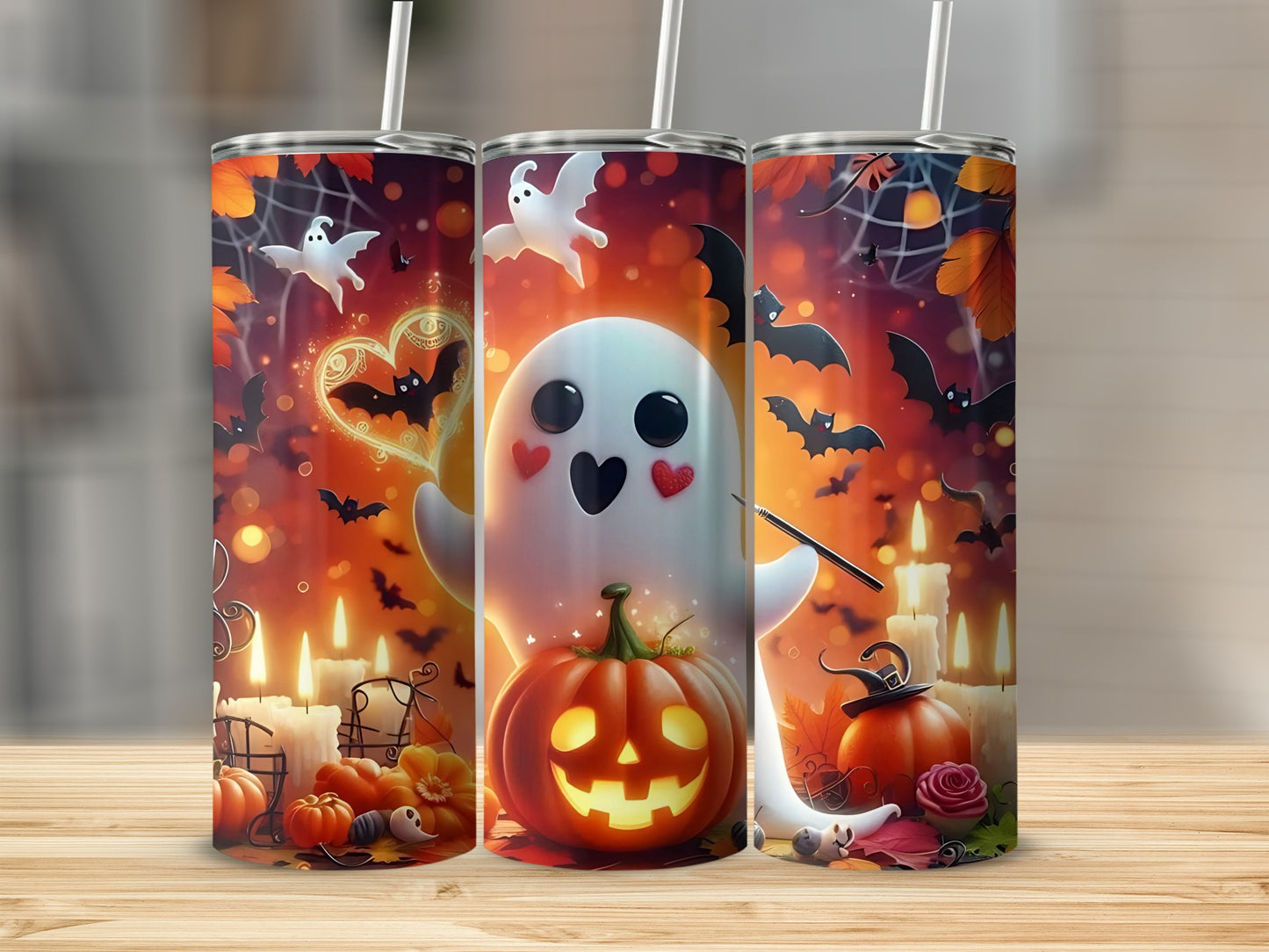 Three tumblers with Halloween ghosts, pumpkins, bats, candles, and autumn leaves.