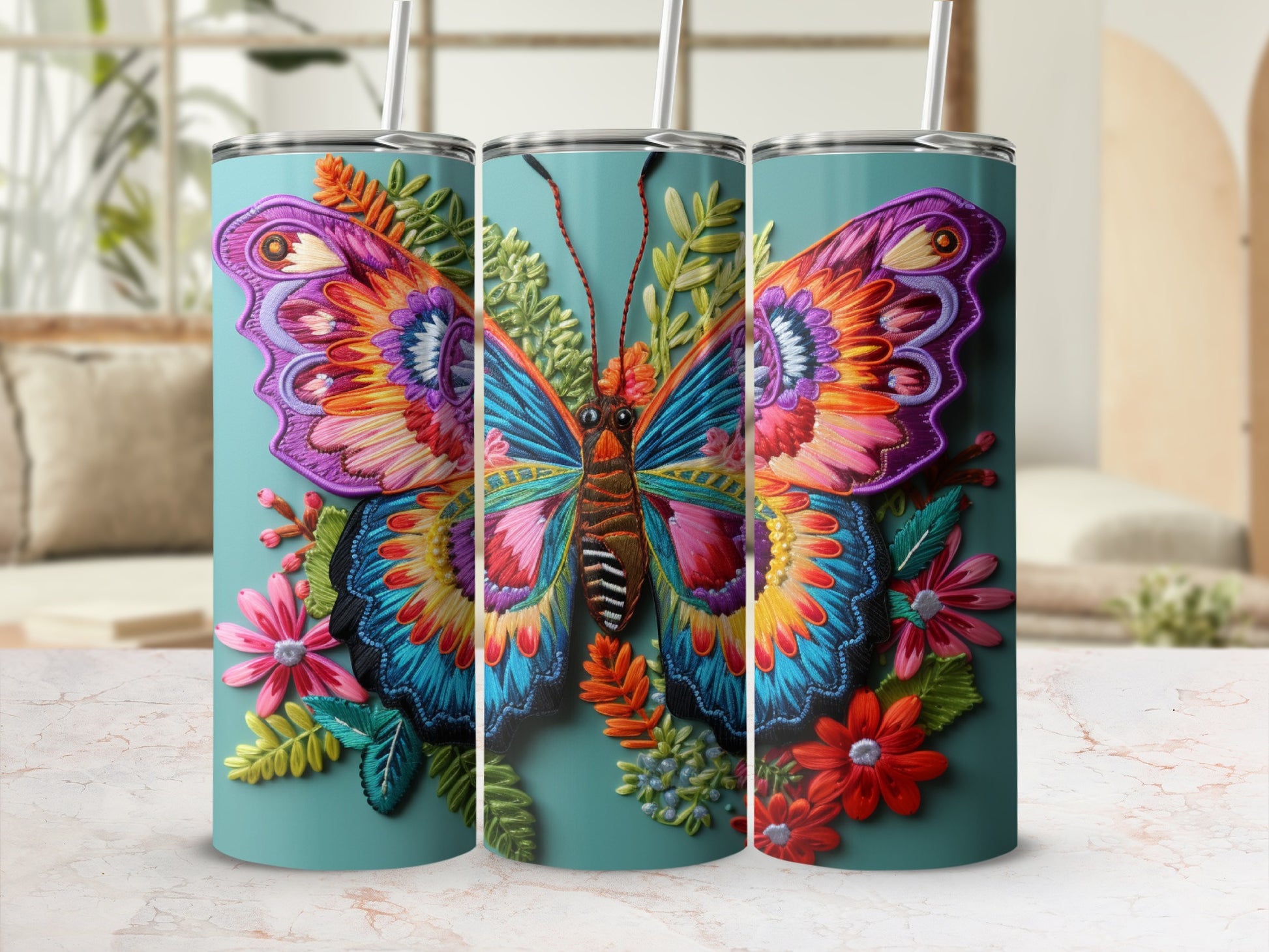 Three tumblers with vibrant, detailed butterfly and floral designs.