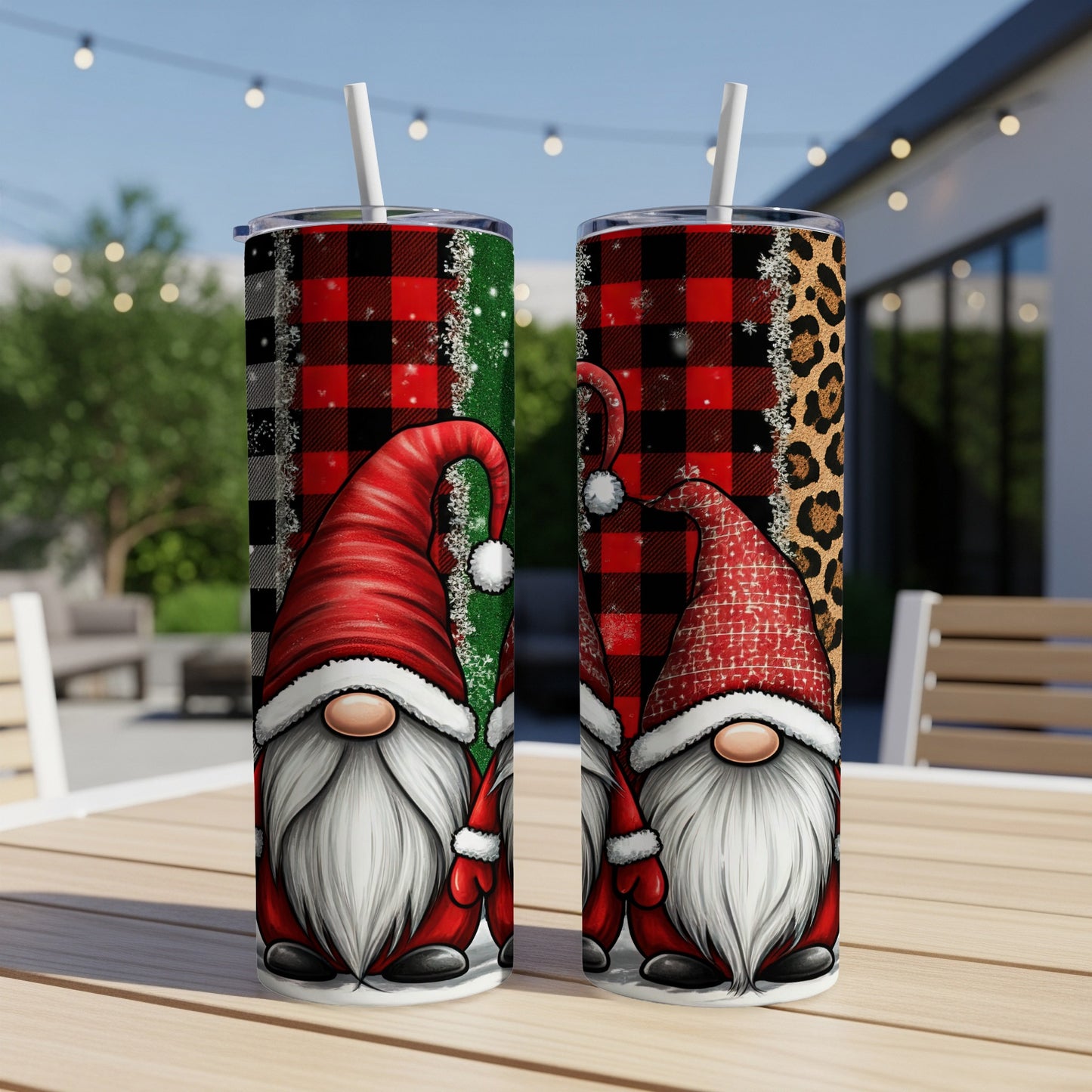 Two Christmas gnomes with red hats and white beards on patterned tumblers.