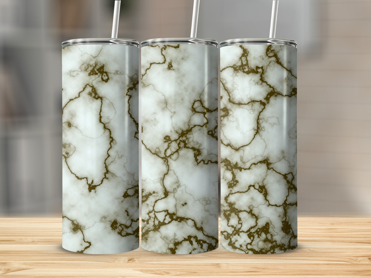 Three tall tumblers with a white and gold marble pattern.