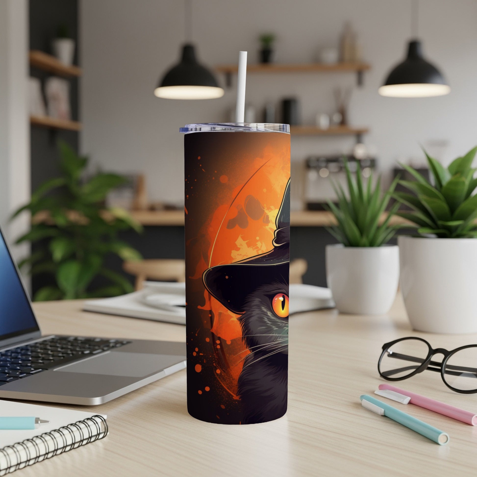 Black cat wearing a witch hat with orange eyes on a tumbler.