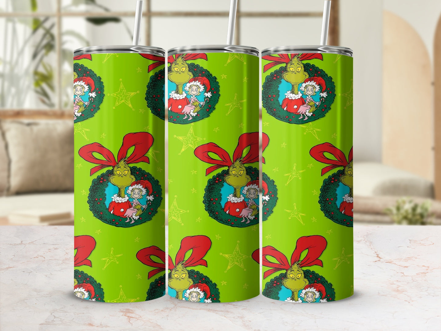 Green tumbler with Grinch and Cindy Lou Who on festive Christmas wreath pattern.