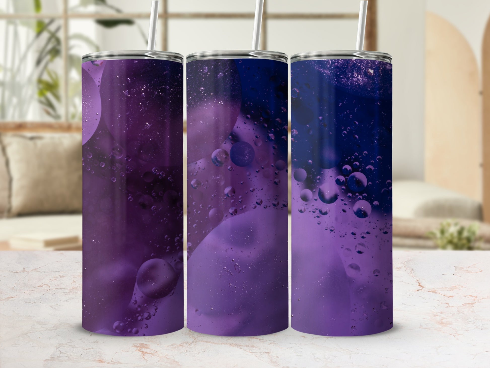 Three purple tumblers with oil and water bubble design.