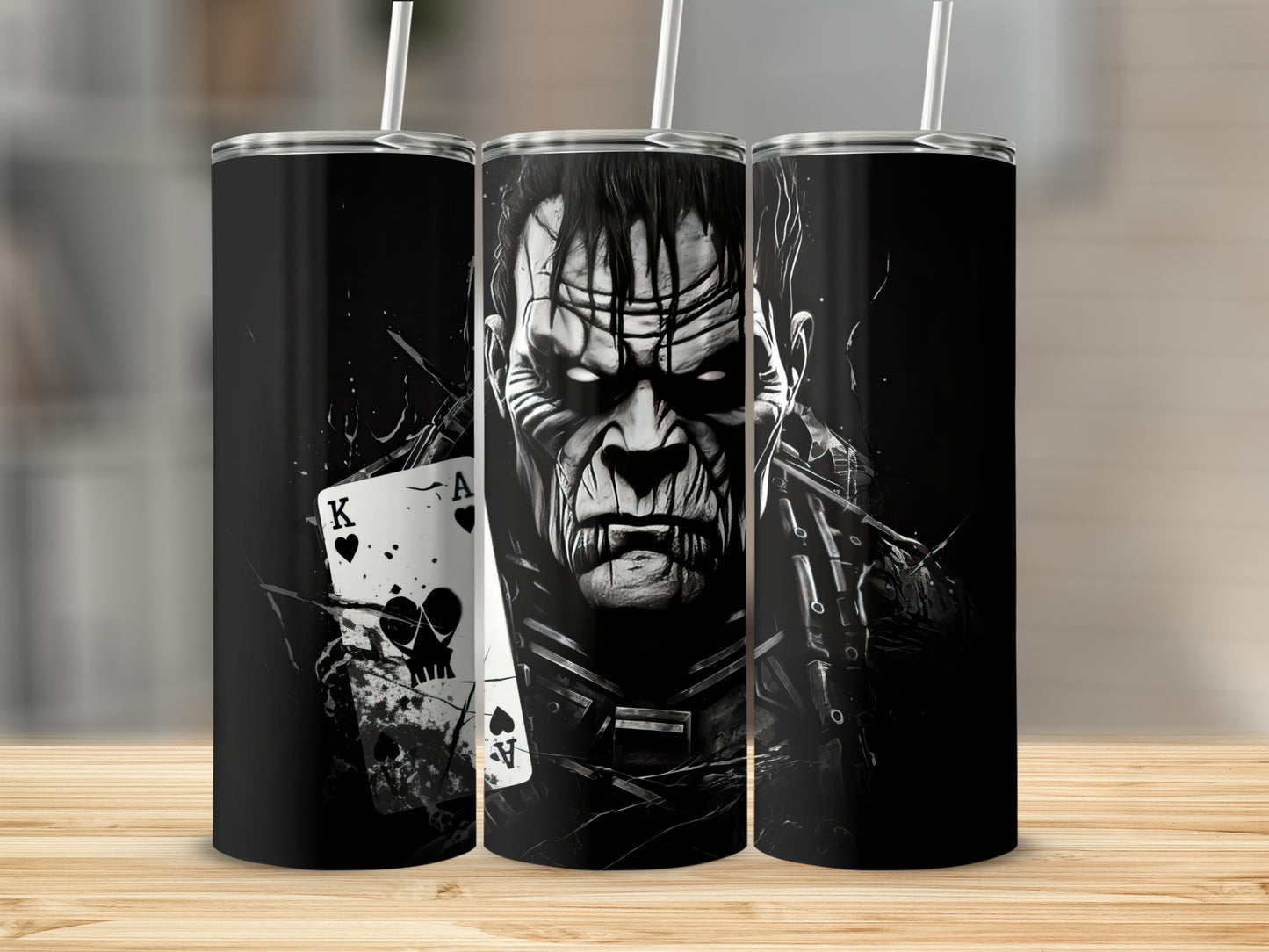 Triptych of black tumblers featuring a monster illustration with playing cards.