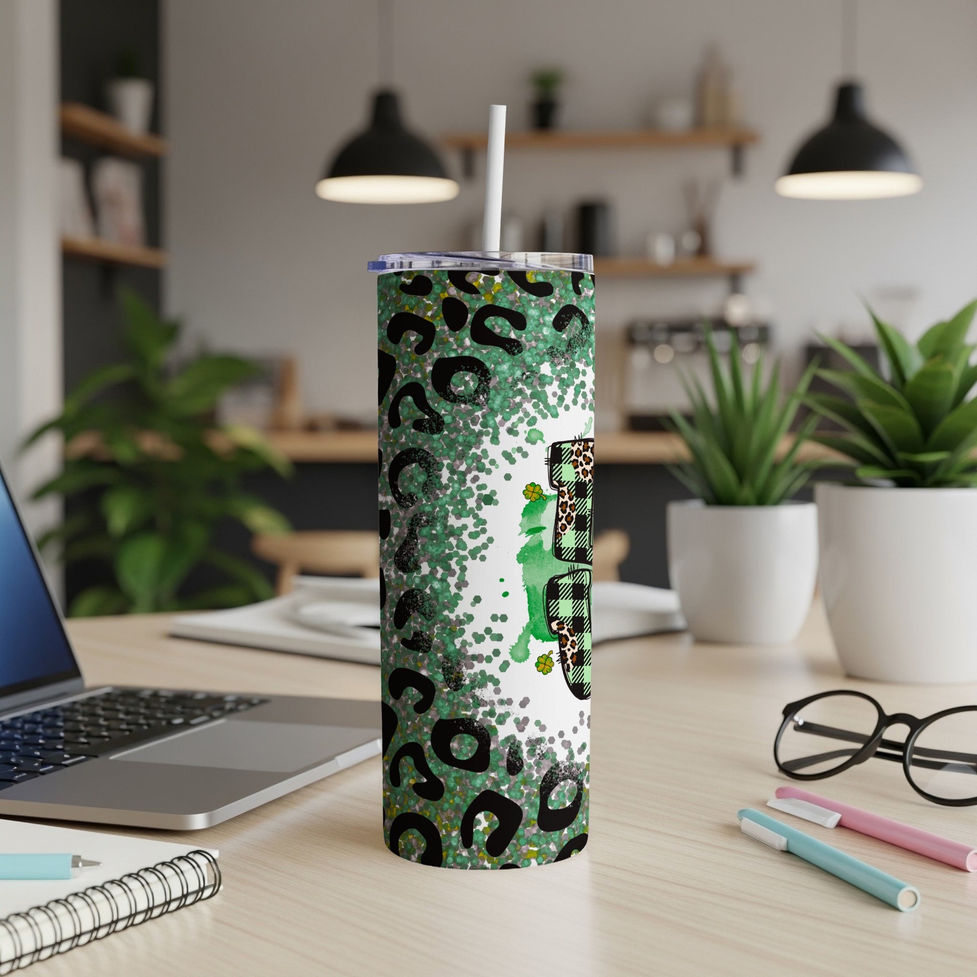 Green glitter and leopard print tumbler with shamrock design.