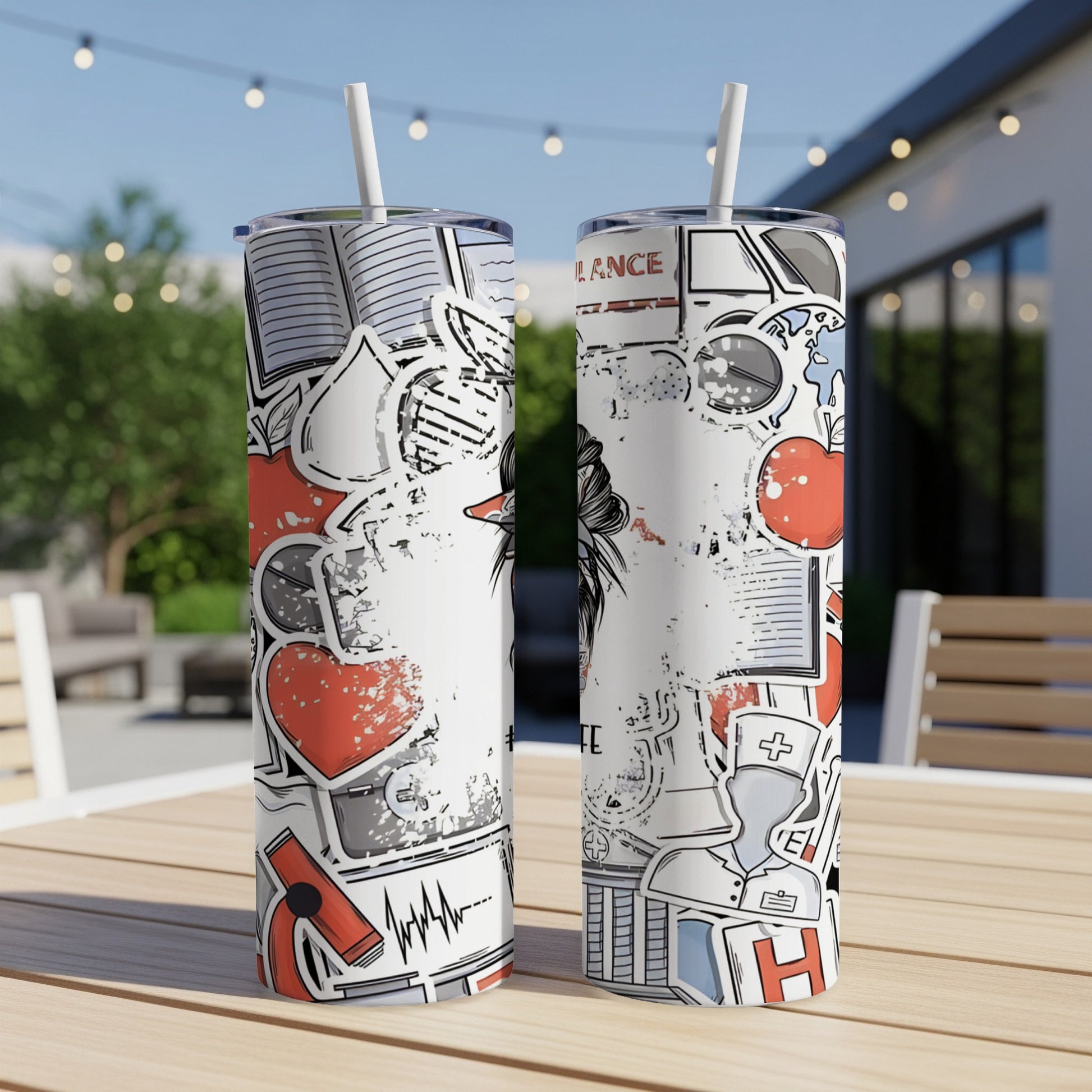 Two tumblers with medical and school-themed graphics on a wooden table outdoors.
