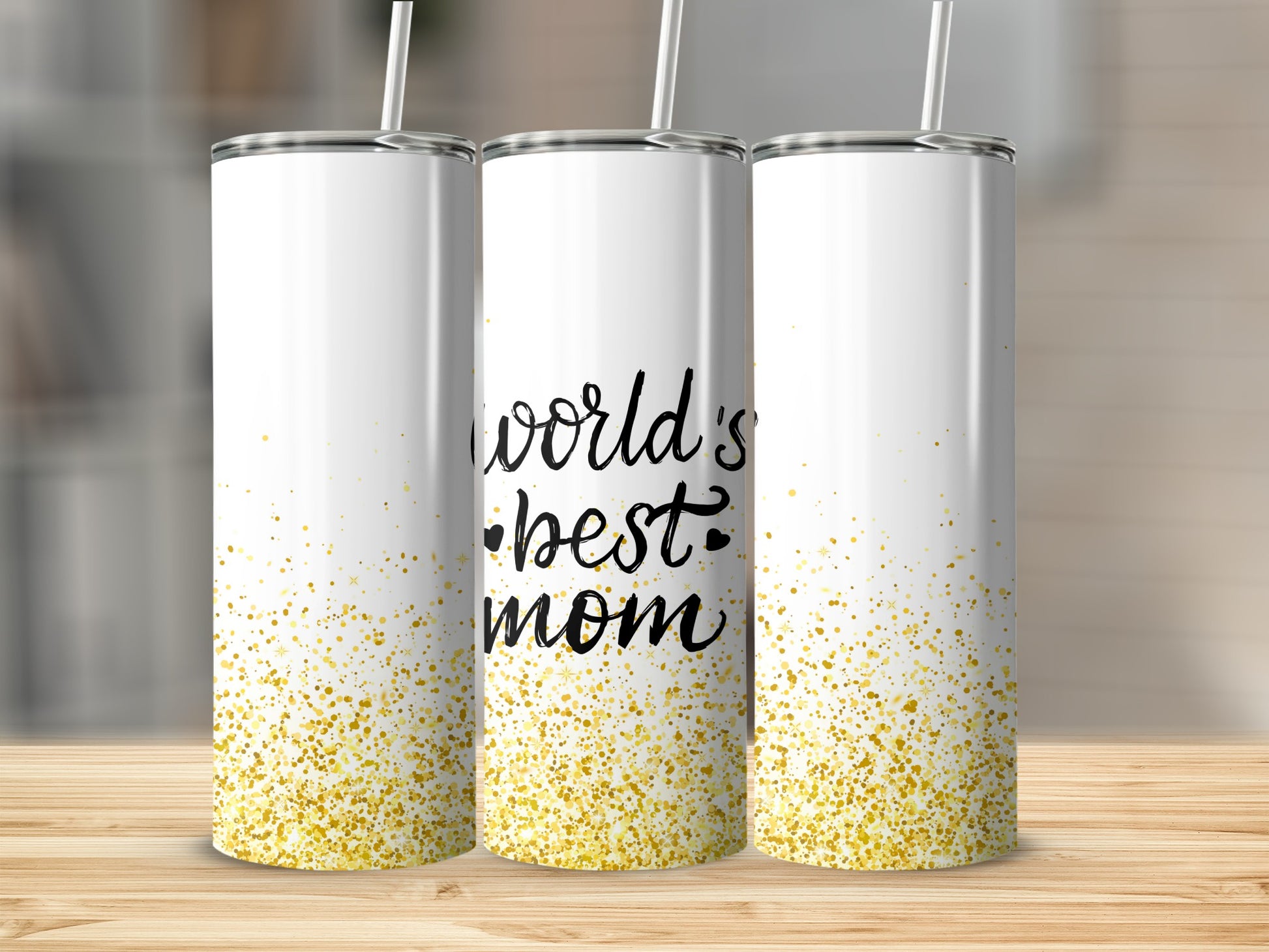 White tumblers with gold glitter and "world's best mom" text.
