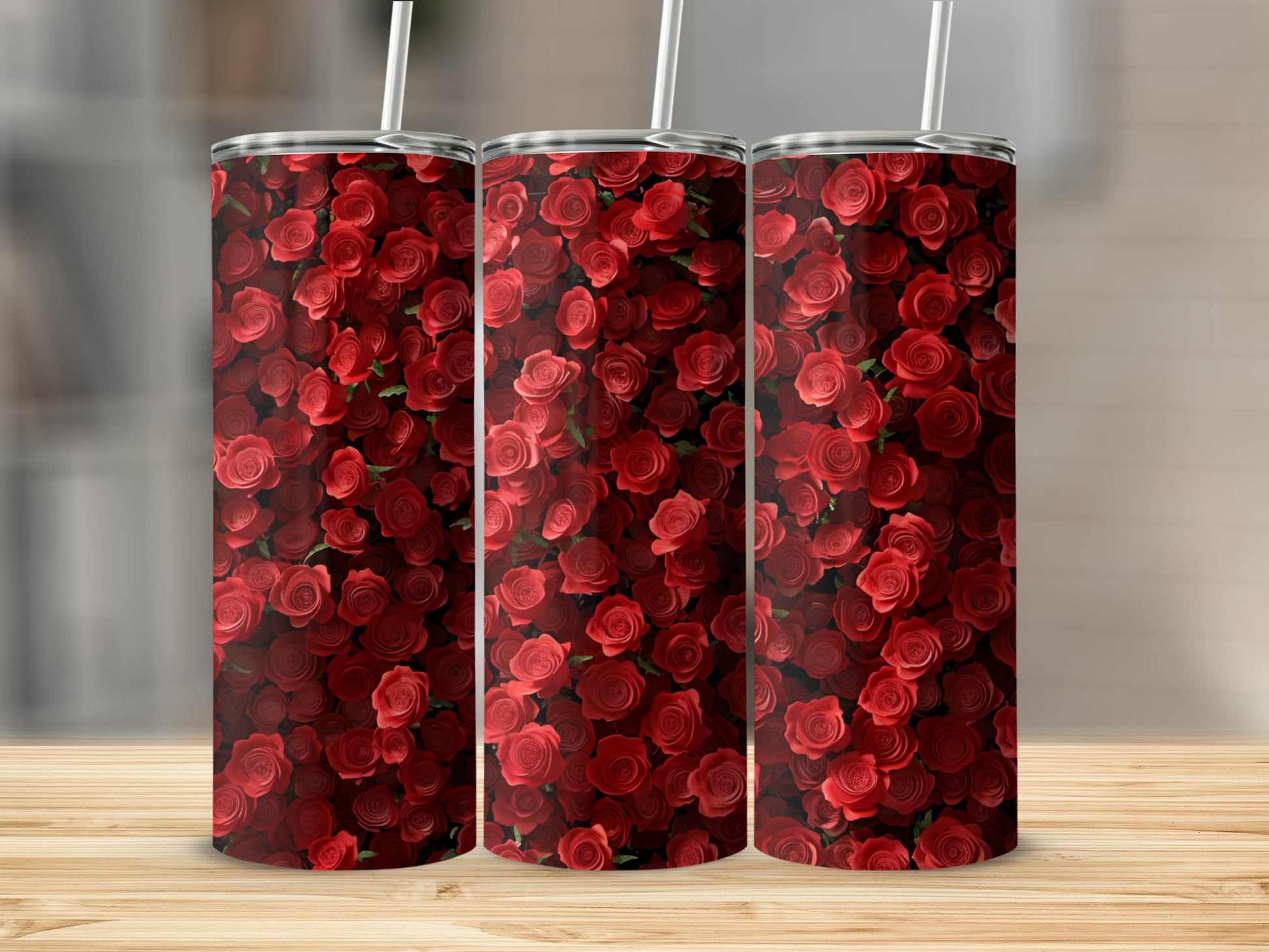 Three tumblers with a repeating pattern of red roses.
