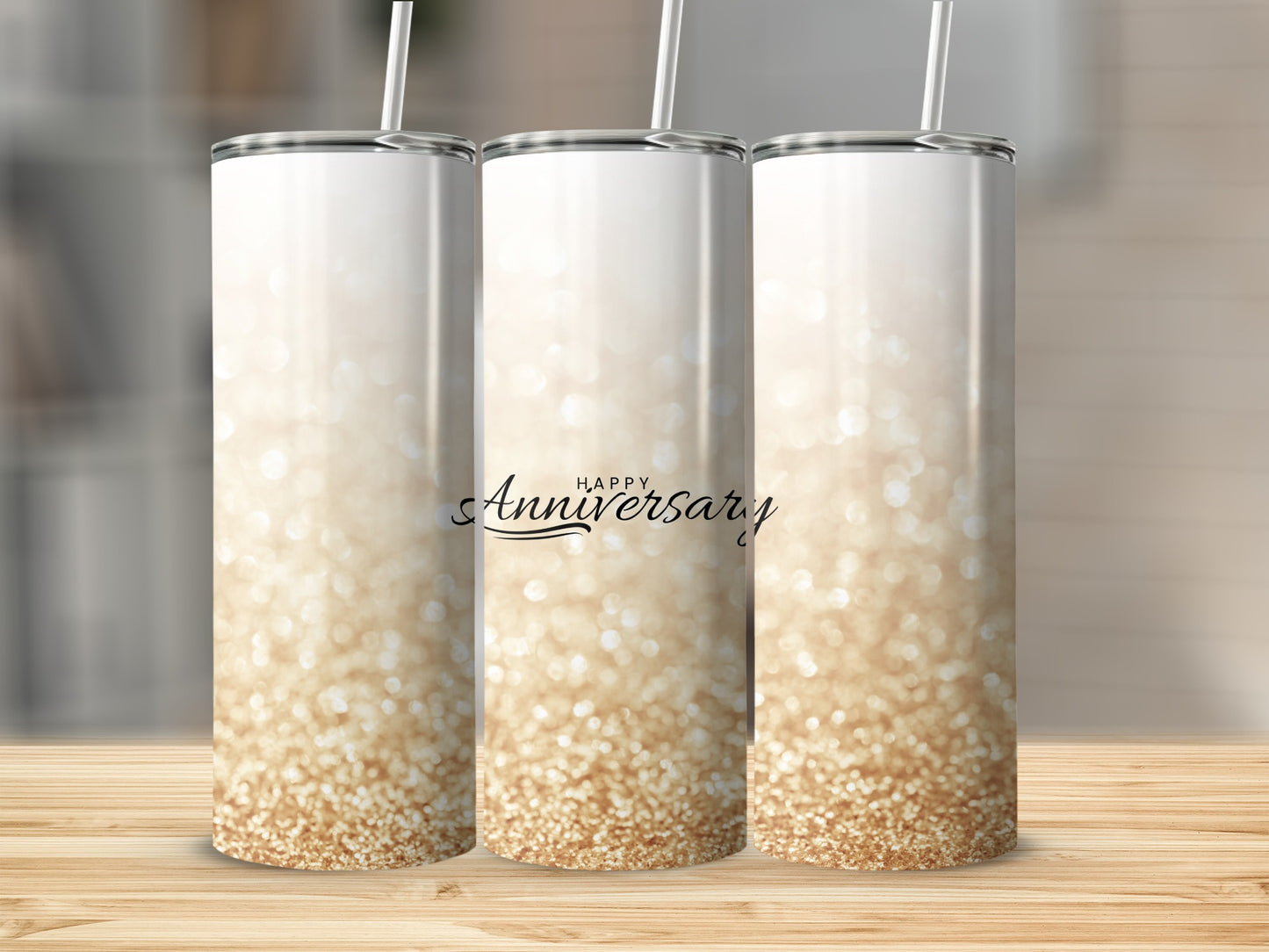 Three glitter-covered tumblers with "Happy Anniversary" text.