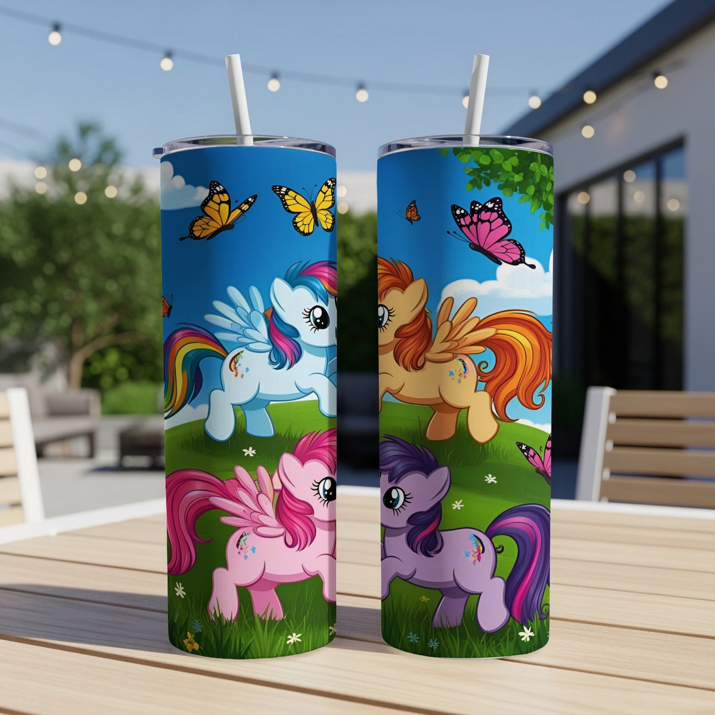 Two My Little Pony tumblers with cartoon ponies and butterflies on a table.