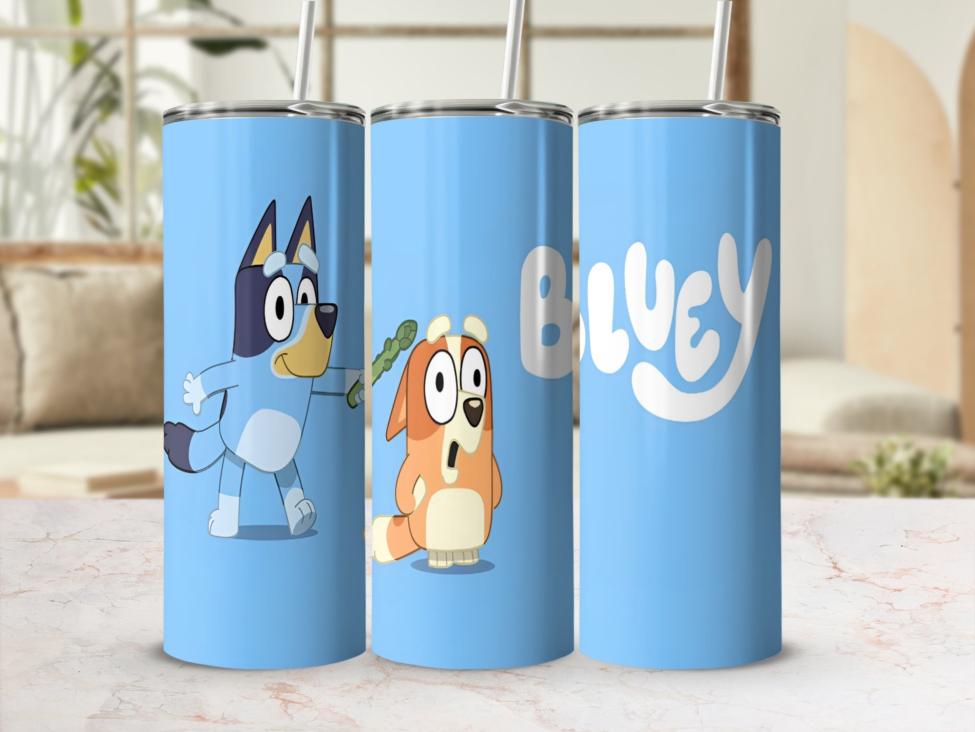 Bluey and Bingo characters with "BLUEY" text on a light blue tumbler.