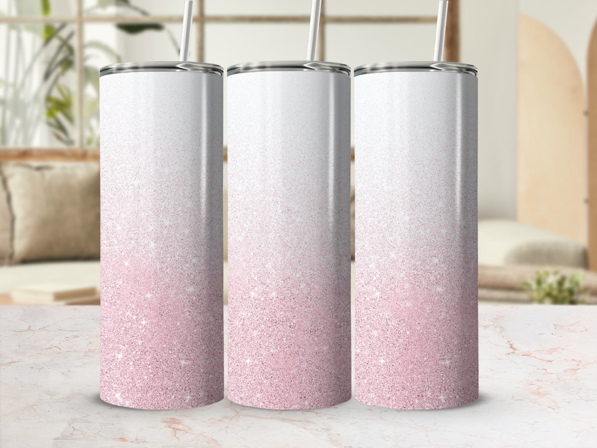 Three tall tumblers with pink glitter gradient and white tops.