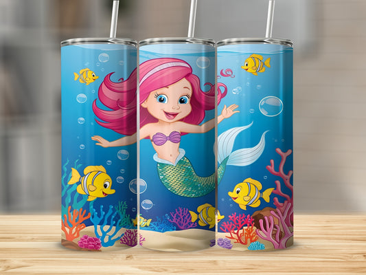 Cute cartoon mermaid with pink hair swimming among colorful fish and coral reefs.