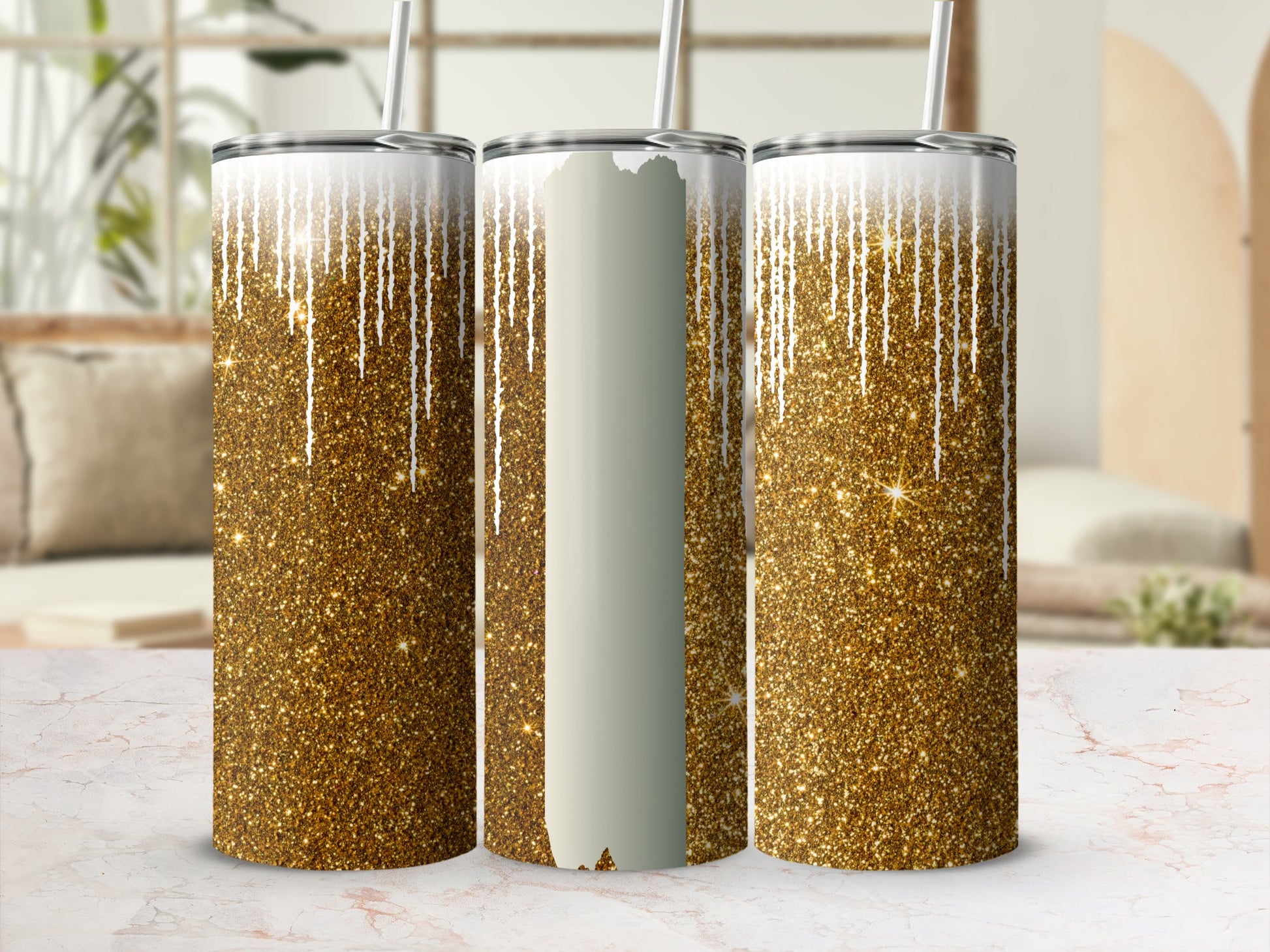 Three tumblers with gold glitter and dripping white accents.