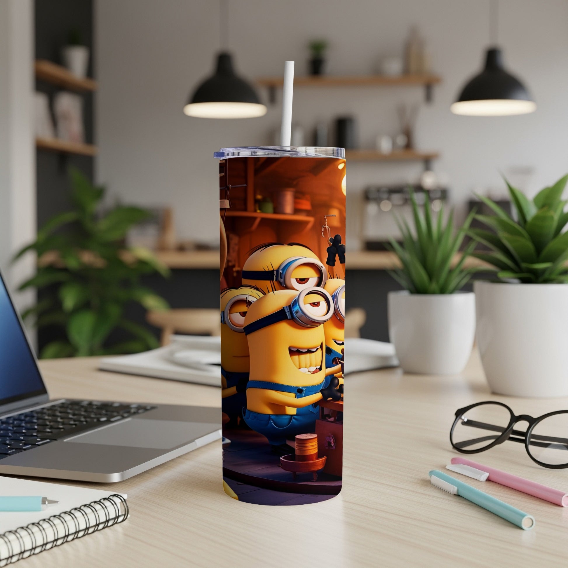 Minions from Despicable Me holding a drink on a tumbler cup.