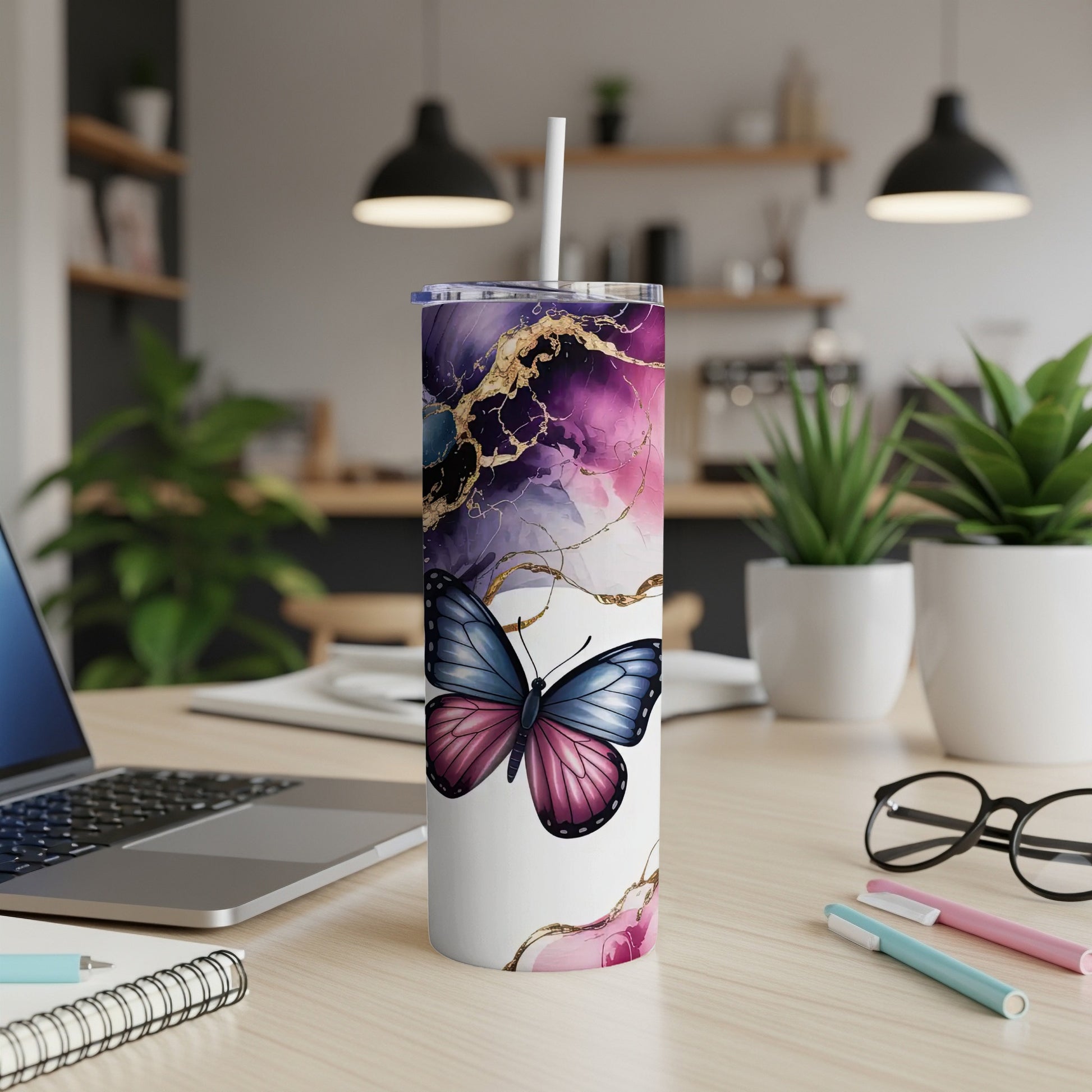 White tumbler with purple and blue marbled butterfly design.