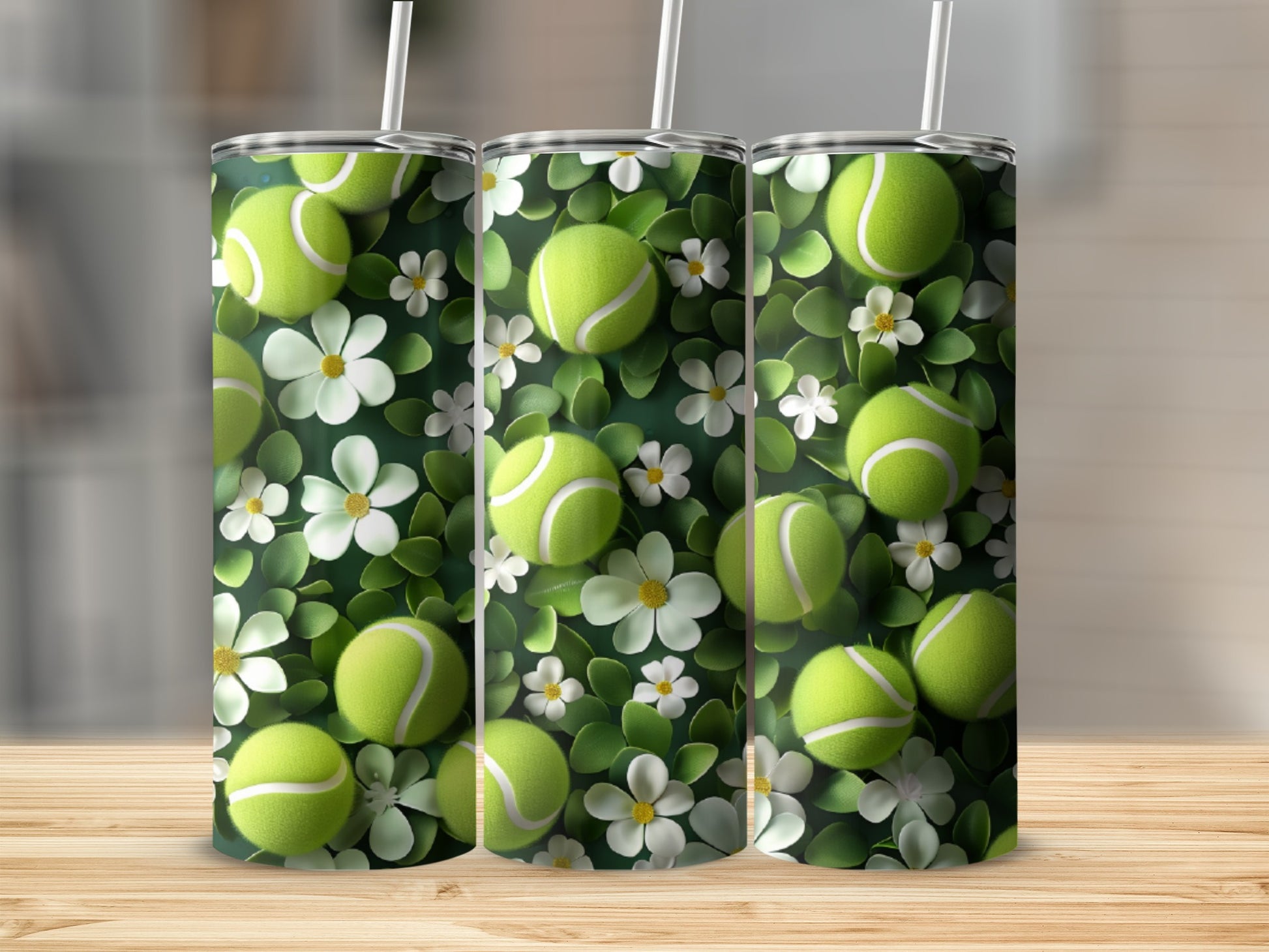 Tennis balls and white flowers pattern on three tumblers.