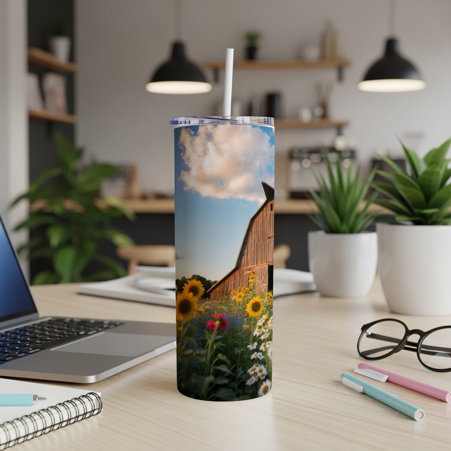 Tall tumbler with a vibrant barn and sunflower field illustration.