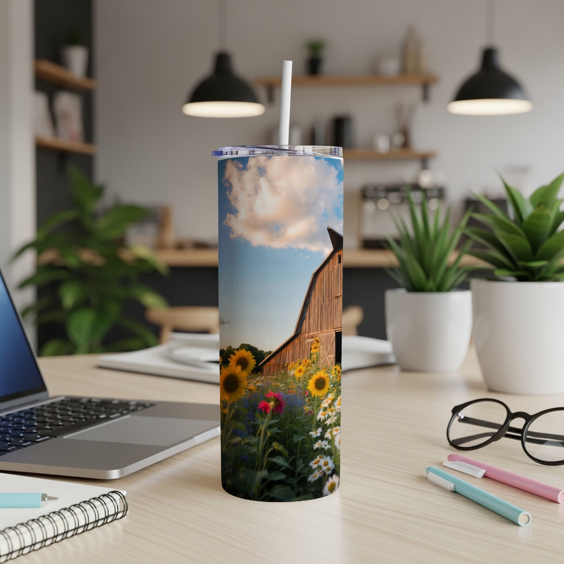 Tall tumbler with a vibrant barn and sunflower field illustration.