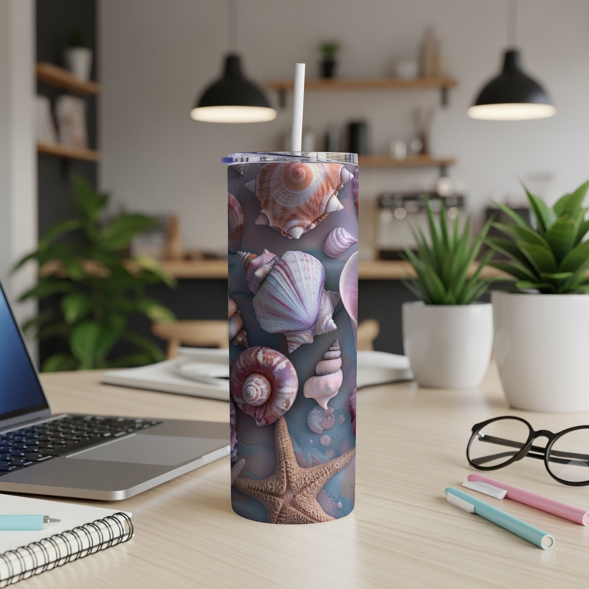 Seashell and starfish pattern on a white tumbler with a straw.