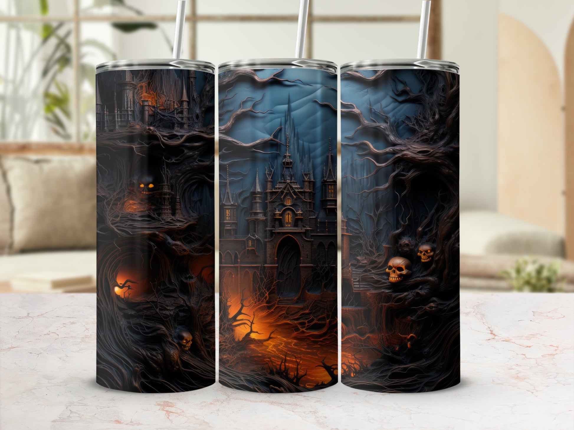 Three tumblers with a spooky castle, skulls, and twisted trees design.