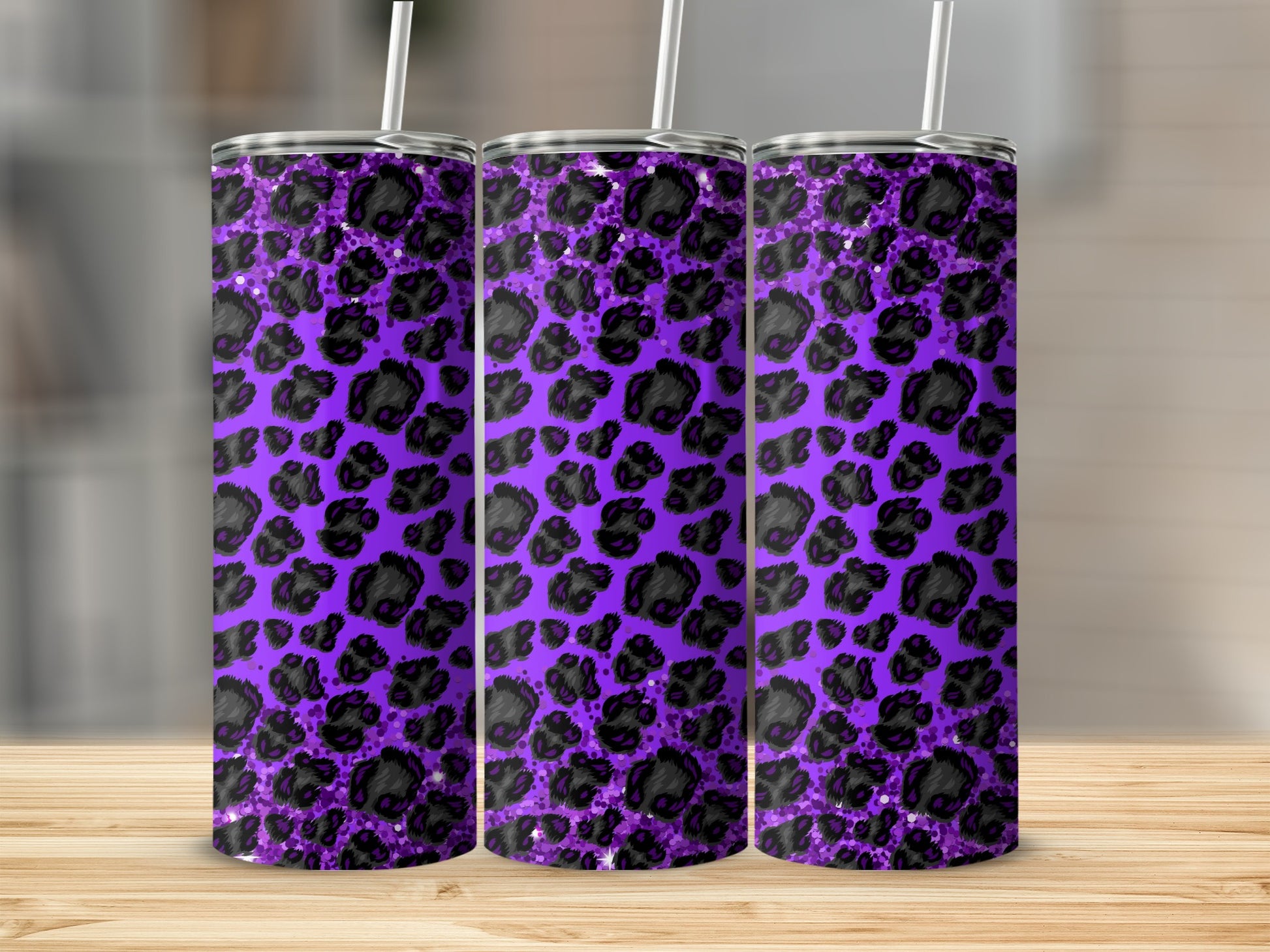 Purple tumbler with black leopard print and straw.