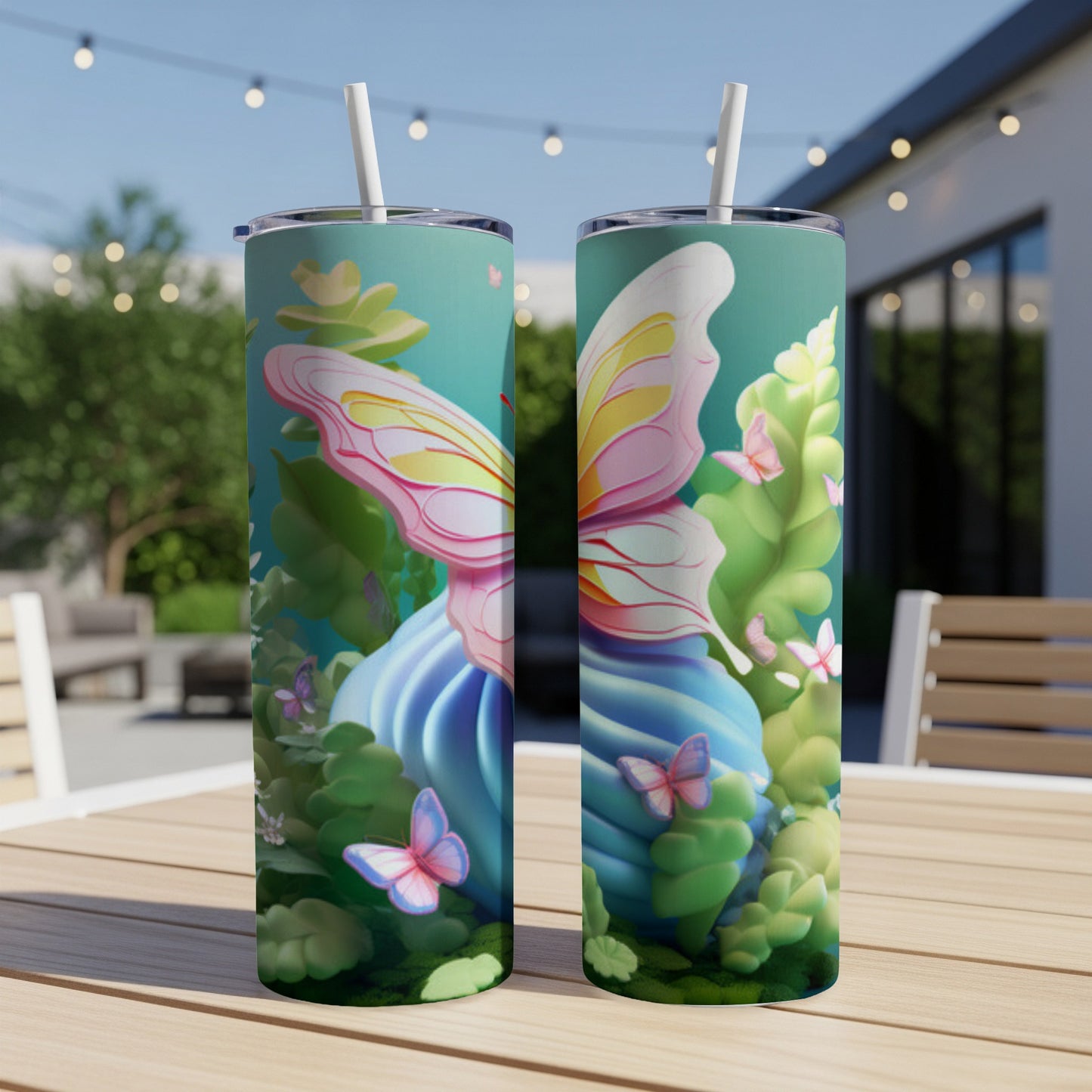 Two tumblers with butterfly and floral designs on a table.