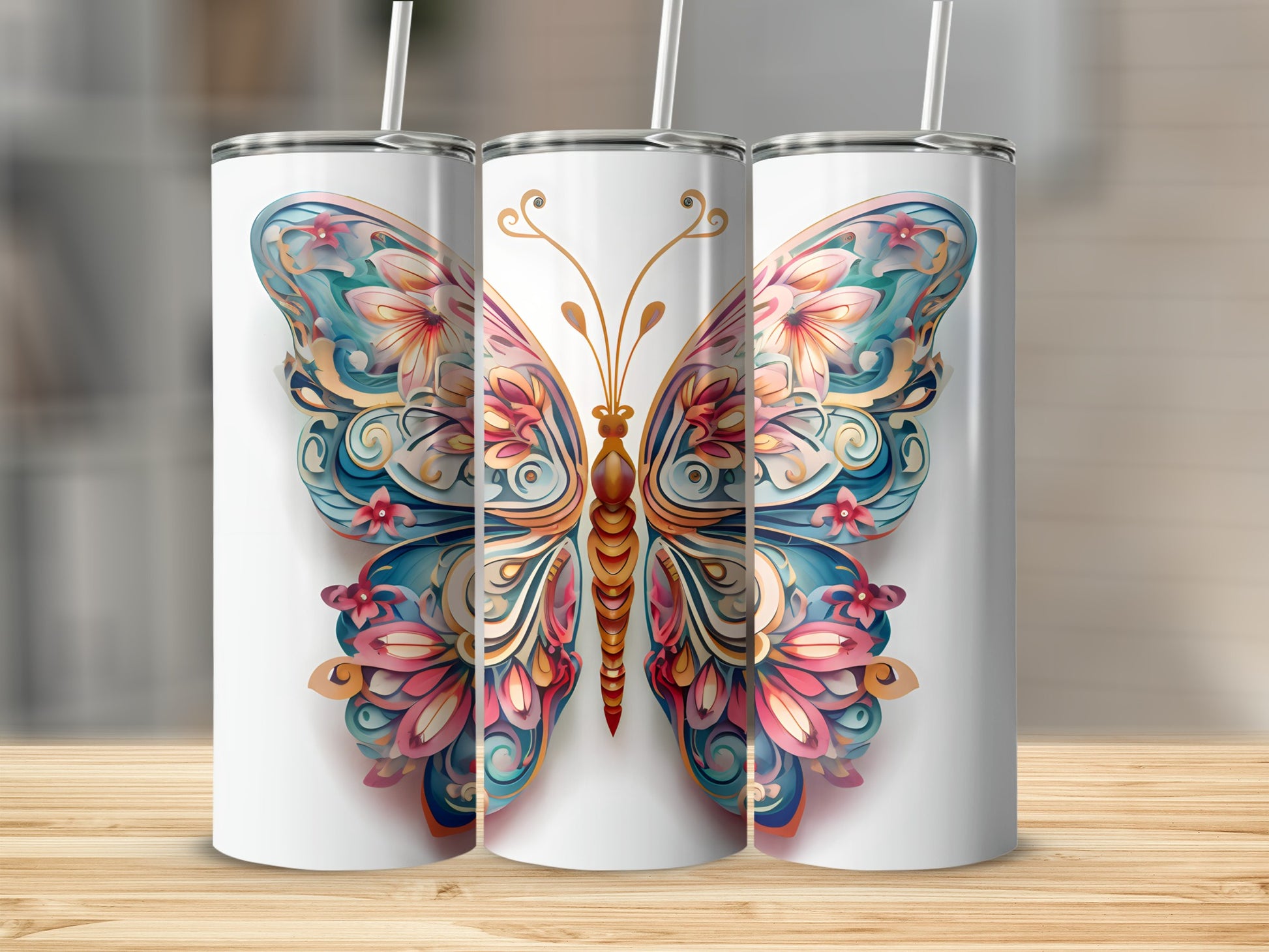 Three tumblers with a colorful butterfly design.