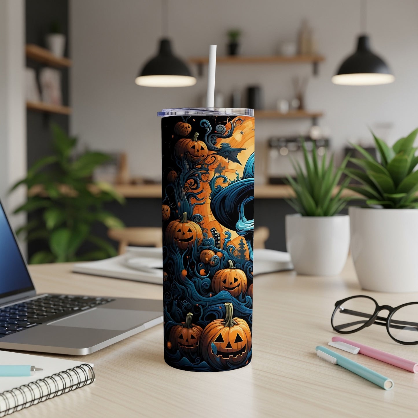 Tumbler with Halloween pumpkins, spooky trees, and a witch's hat design.