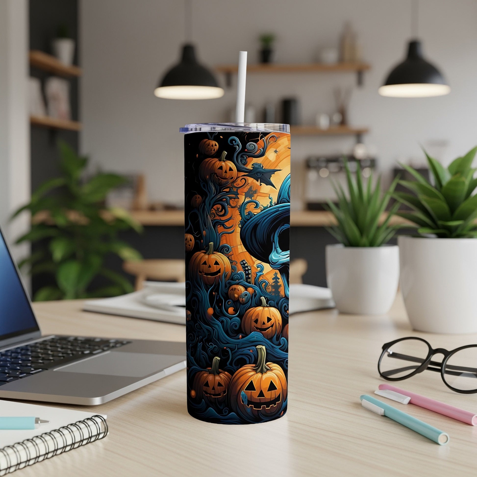 Tumbler with Halloween pumpkins, spooky trees, and a witch's hat design.