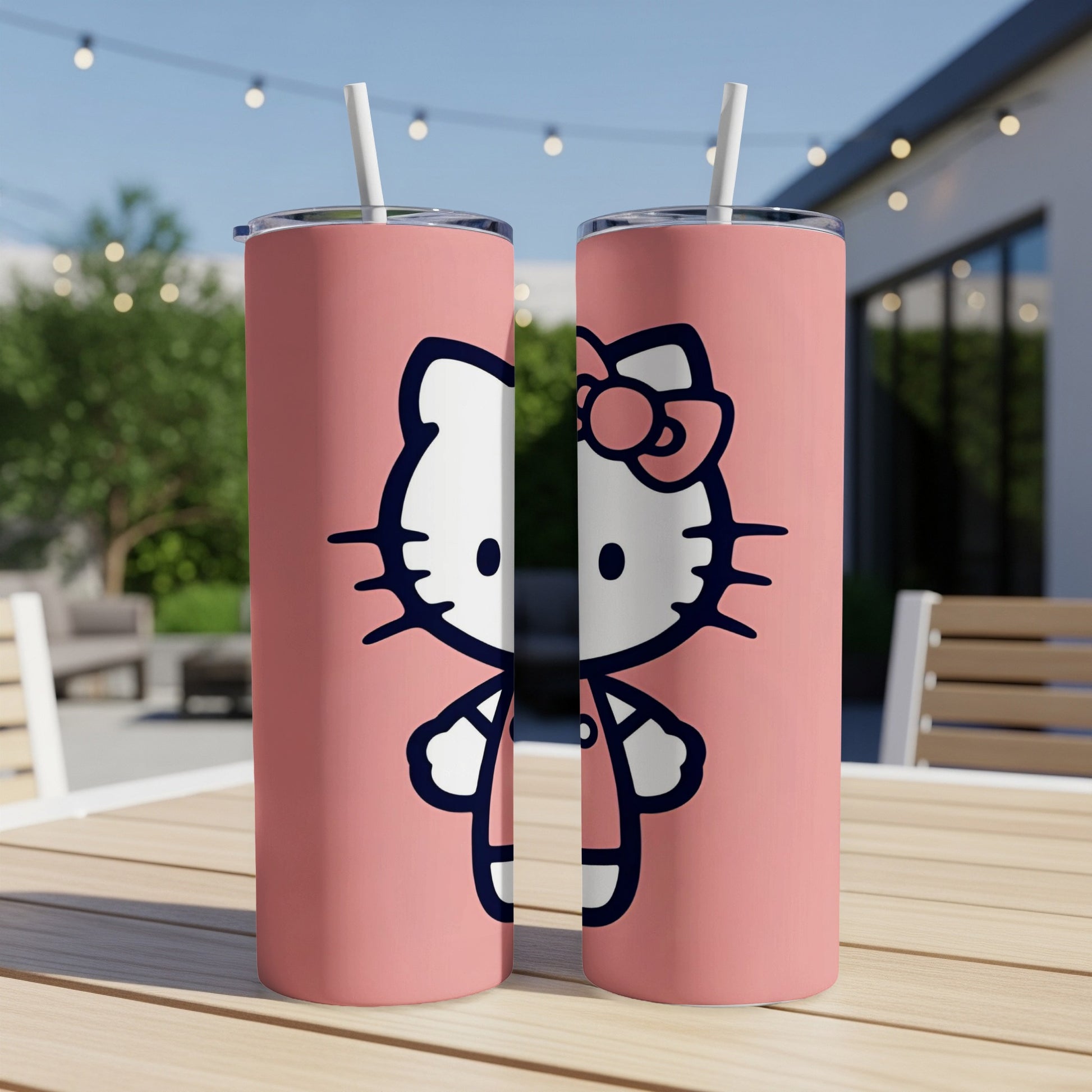 Two pink tumblers featuring Hello Kitty with a straw.