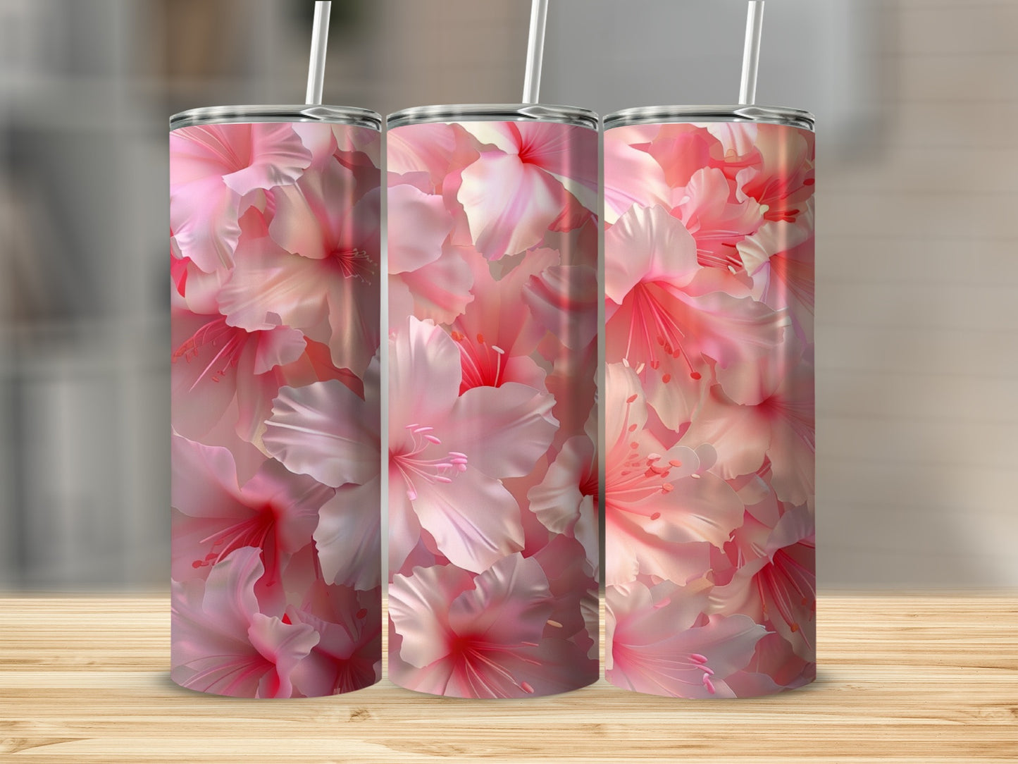 Three tumblers with a pink hibiscus floral pattern.