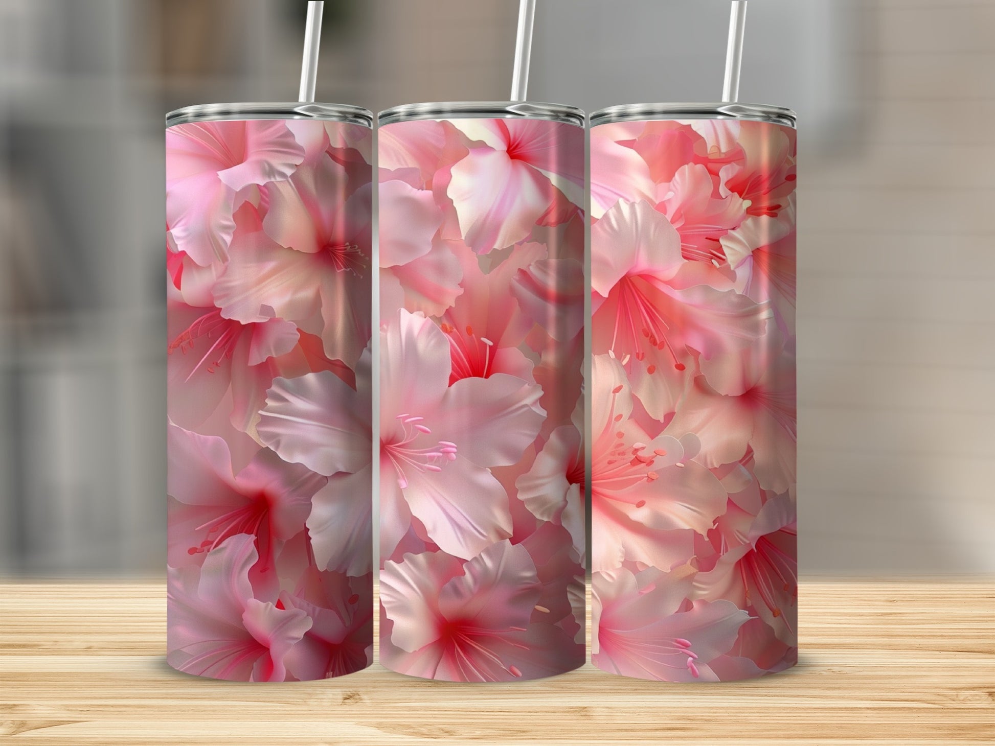 Three tumblers with a pink hibiscus floral pattern.