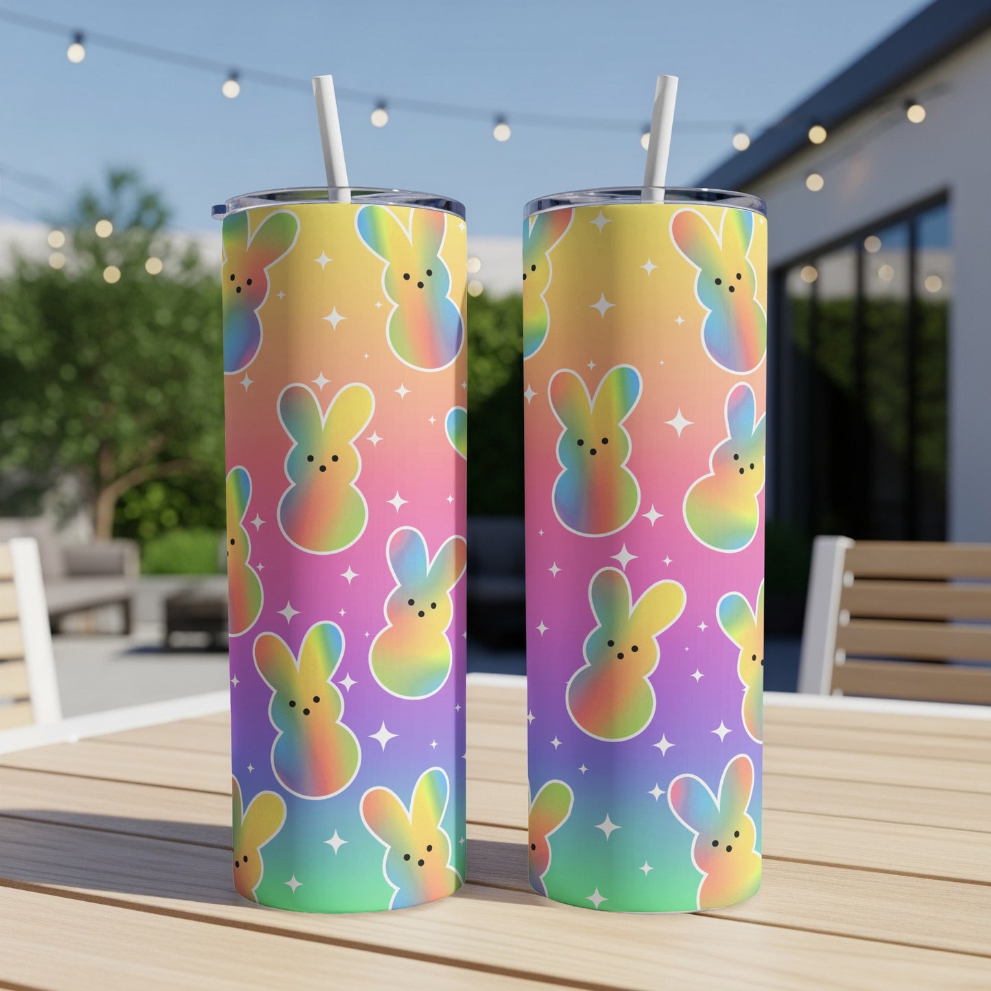 Two rainbow-colored tumblers with a repeating Easter bunny pattern.