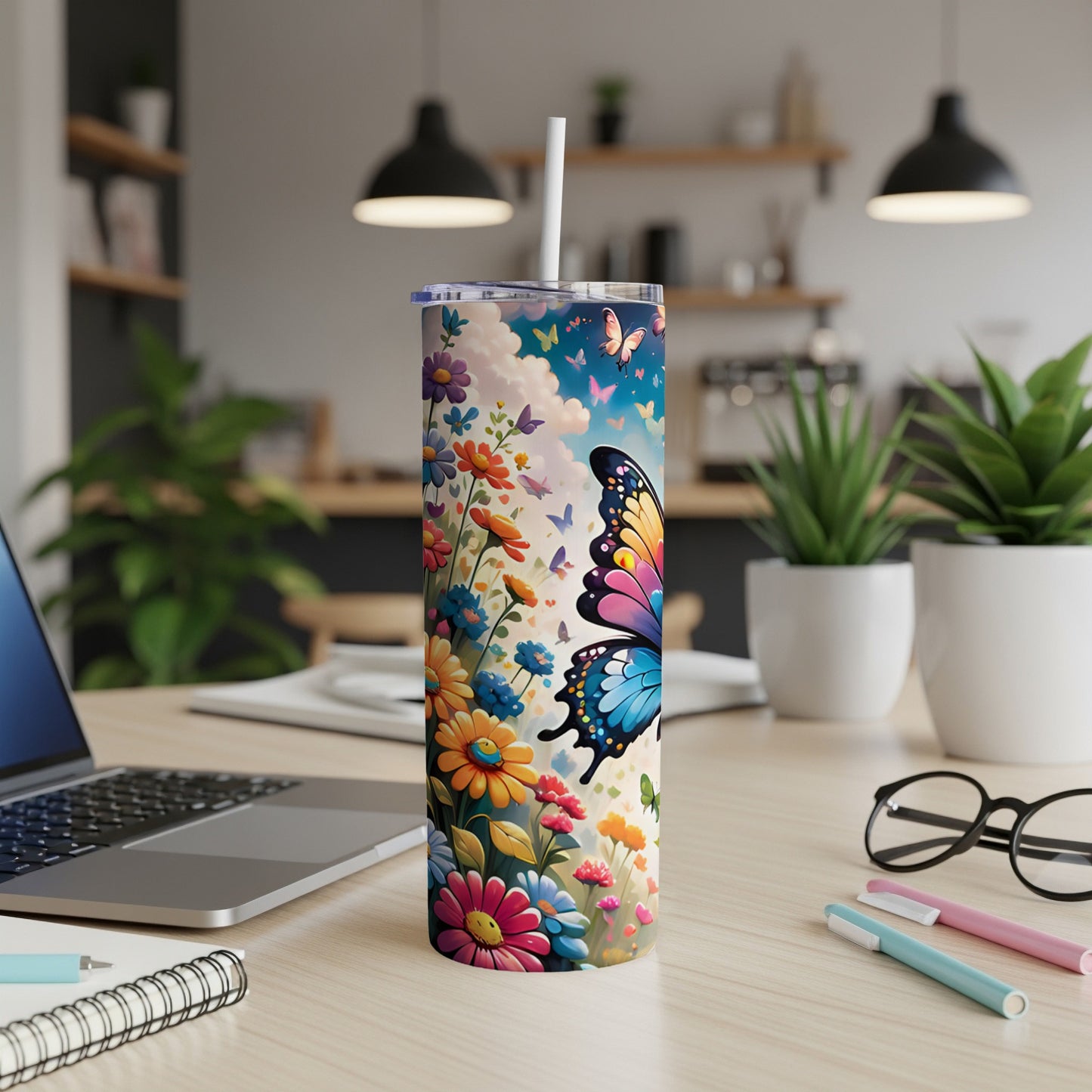 Tall tumbler with a colorful butterfly and floral design.