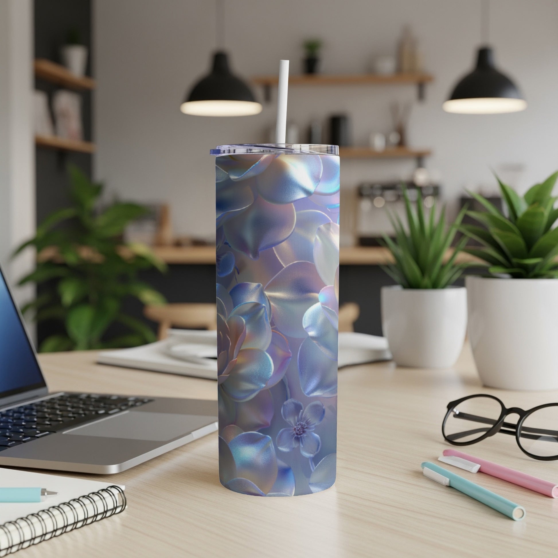 Iridescent succulent floral pattern on a reusable tumbler with a straw.