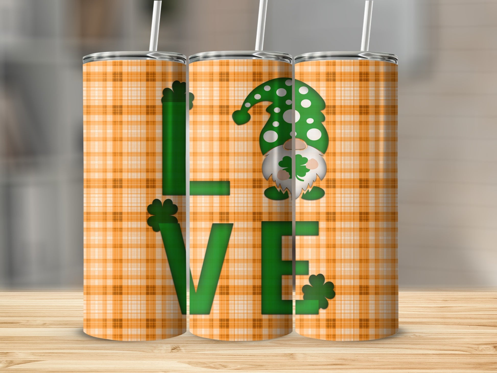 Three tumblers with "LOVE" and St. Patrick's Day gnome pattern.