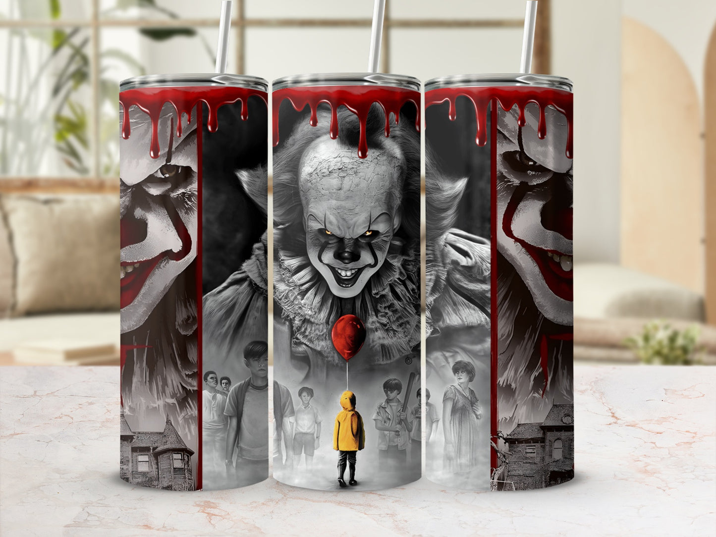 Three tumblers feature Pennywise the clown and scenes from Stephen King's IT.