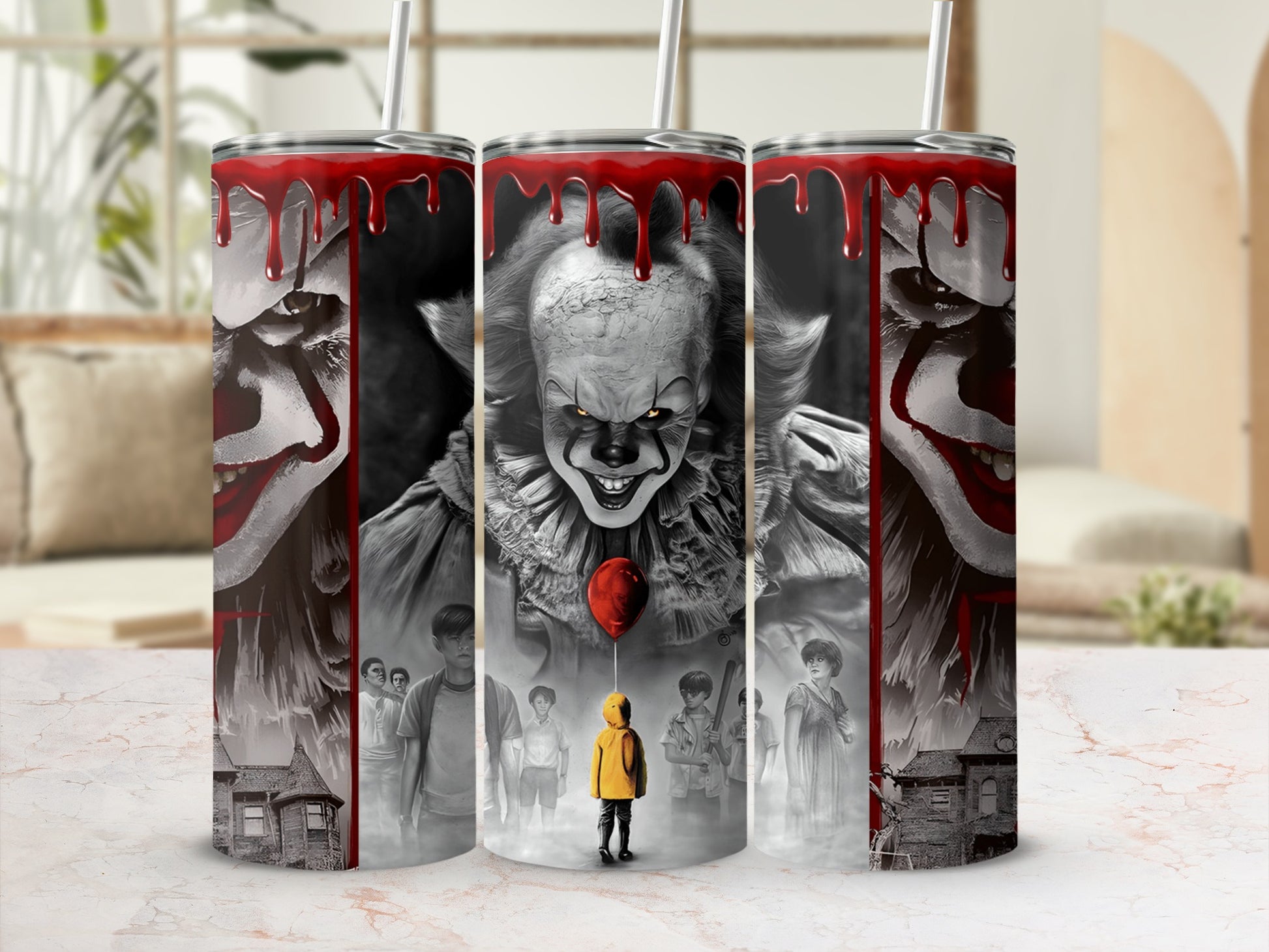 Three tumblers feature Pennywise the clown and scenes from Stephen King's IT.