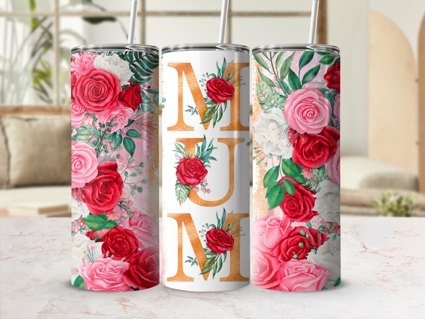 Floral tumbler with "Mum" text in gold glitter on a light marble background.