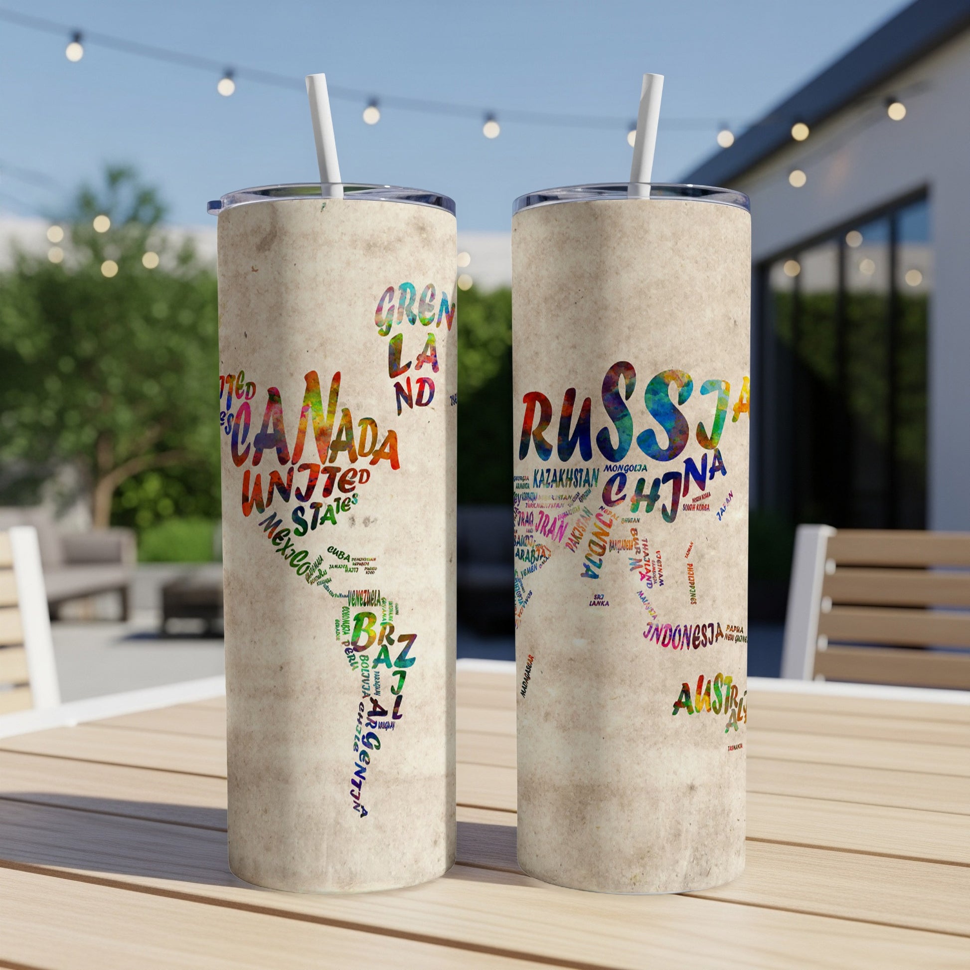 Two tumblers with a world map design made of country names in different colors.