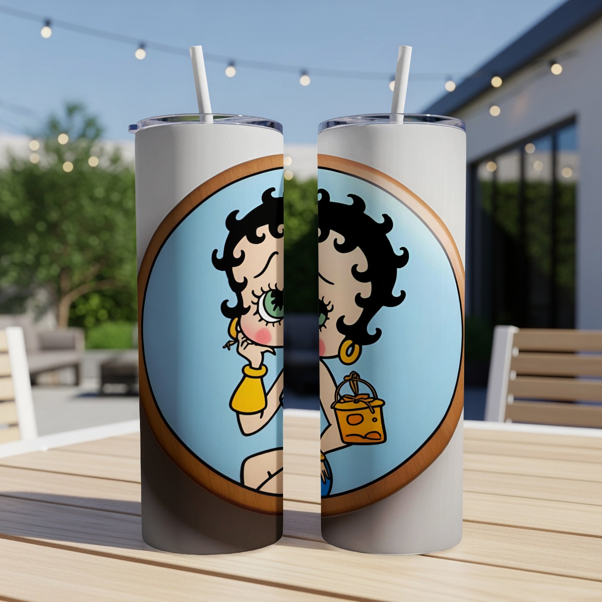 Two Betty Boop tumblers with a blue background and gold purse.