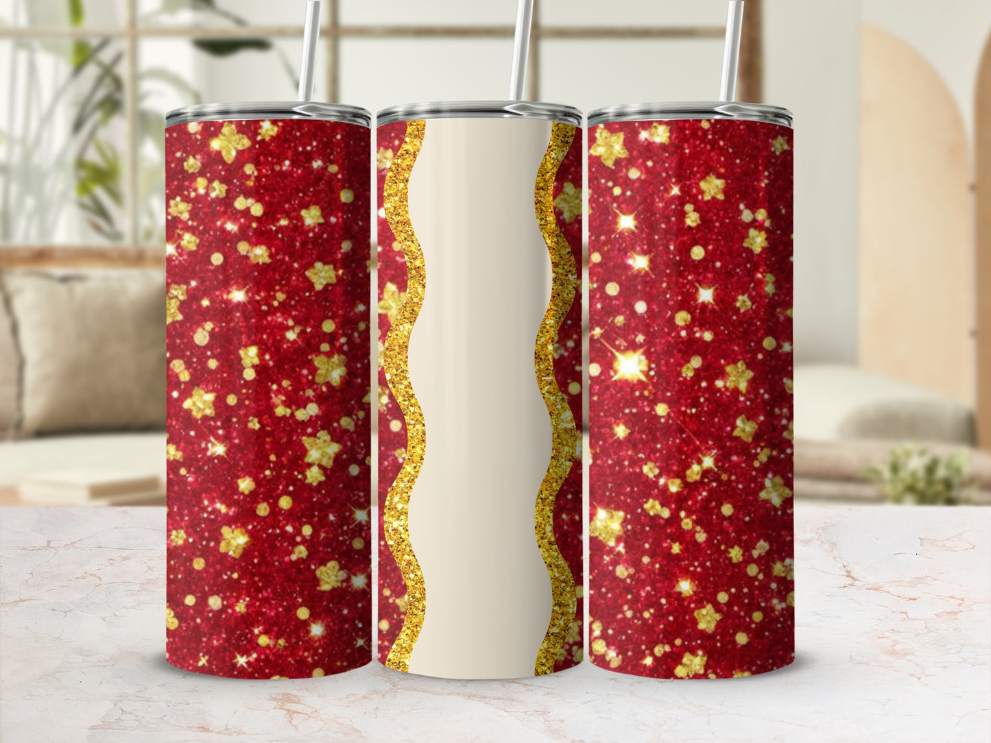 Red glitter tumbler with gold wave detail and straw.
