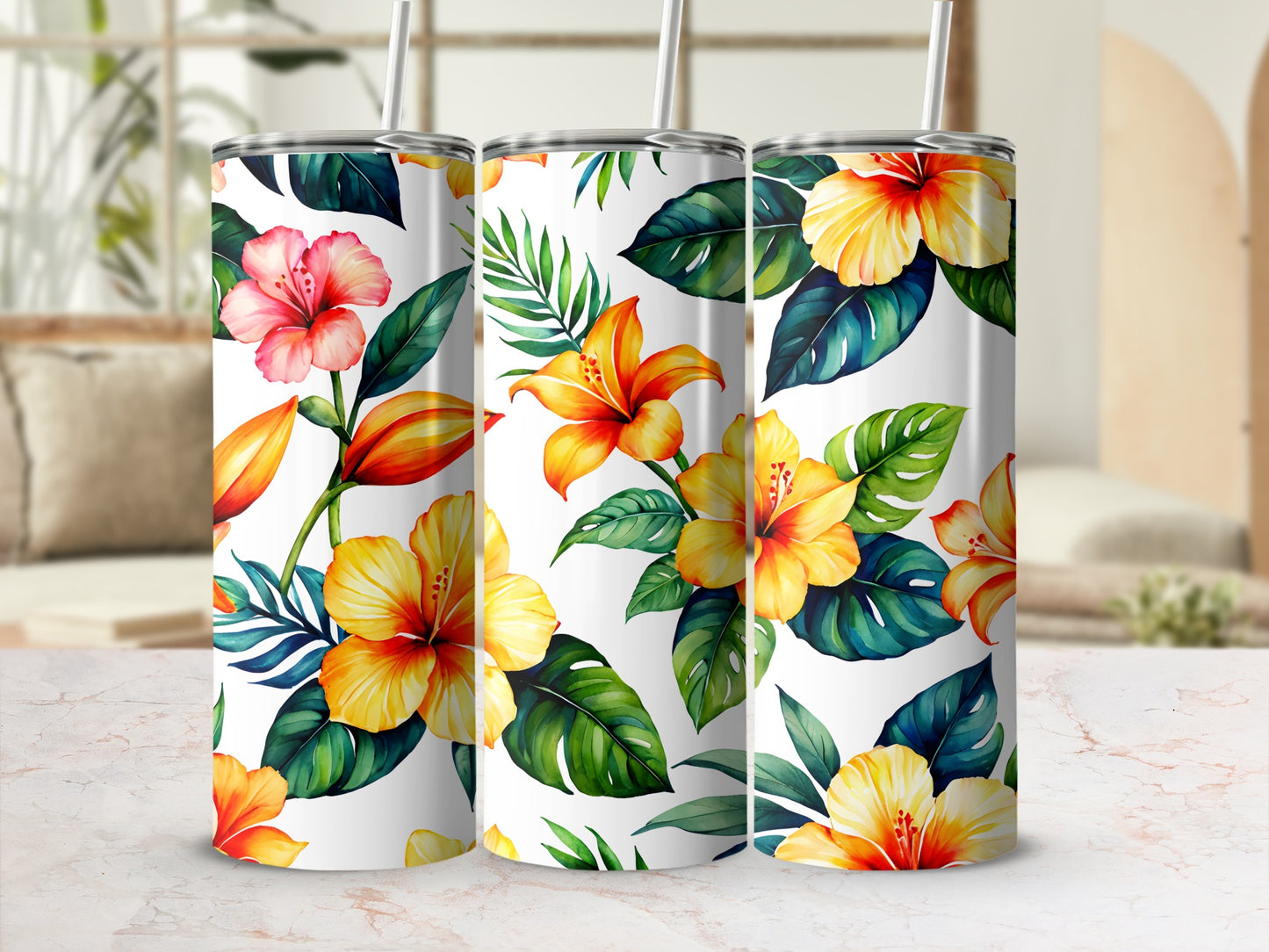 Three tumblers with a vibrant tropical floral and leaf pattern.