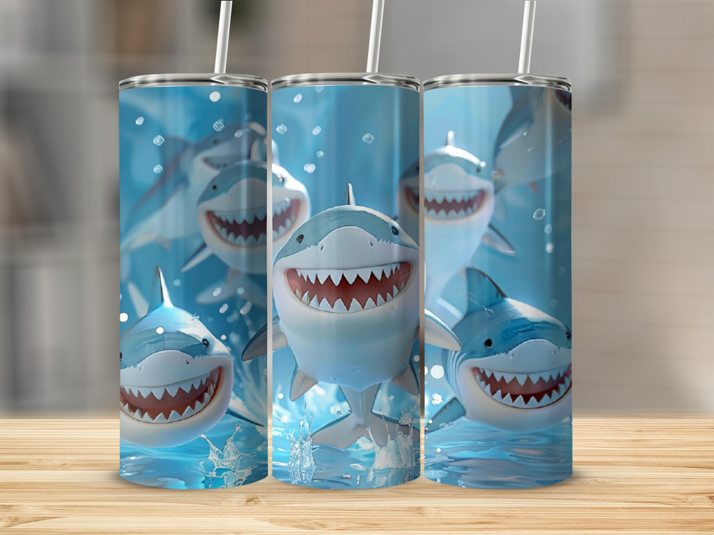 Three tumblers featuring cartoon sharks with open mouths and sharp teeth.