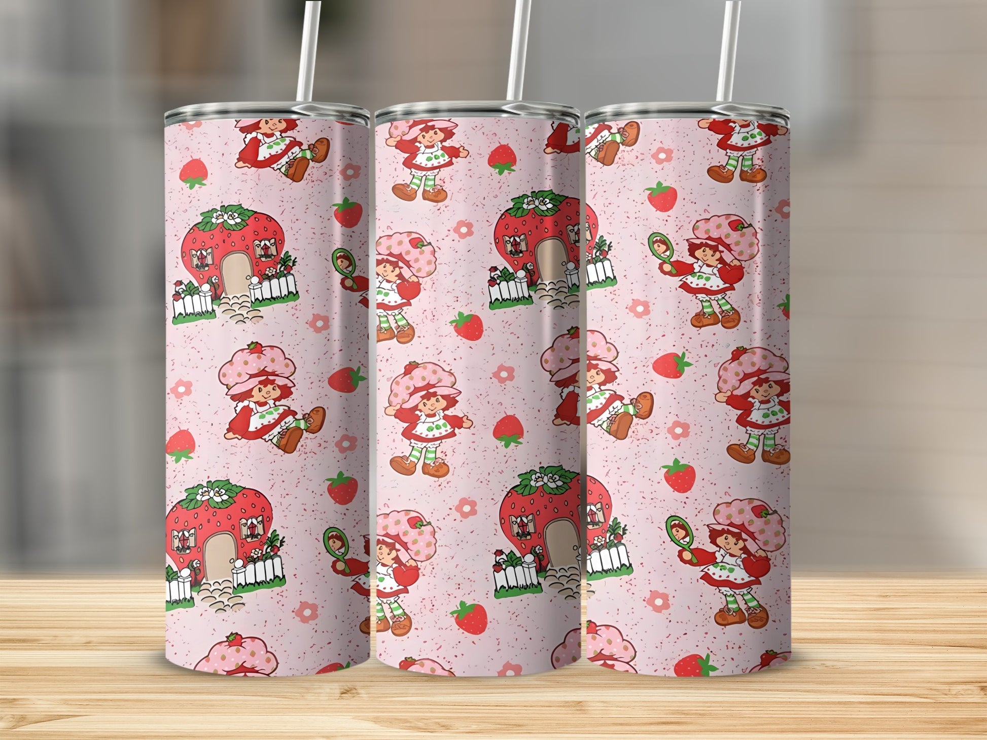 Strawberry Shortcake pattern on pink tumbler with straw.